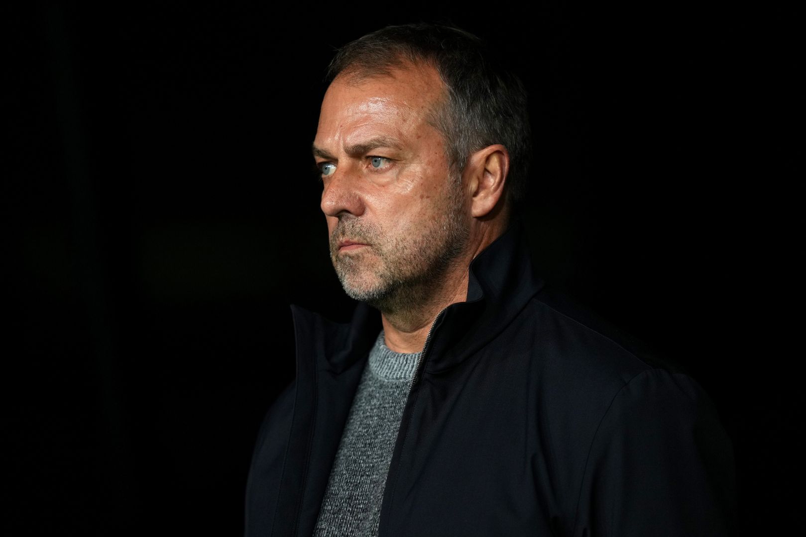 BARCELONA, SPAIN - NOVEMBER 26: Hansi Flick, Head Coach of FC Barcelona, looks on prior to the UEFA Champions League 2024/25 League Phase MD5 match between FC Barcelona and Stade Brestois 29 at Estadi Olimpic Lluis Companys on November 26, 2024 in Barcelona, Spain.