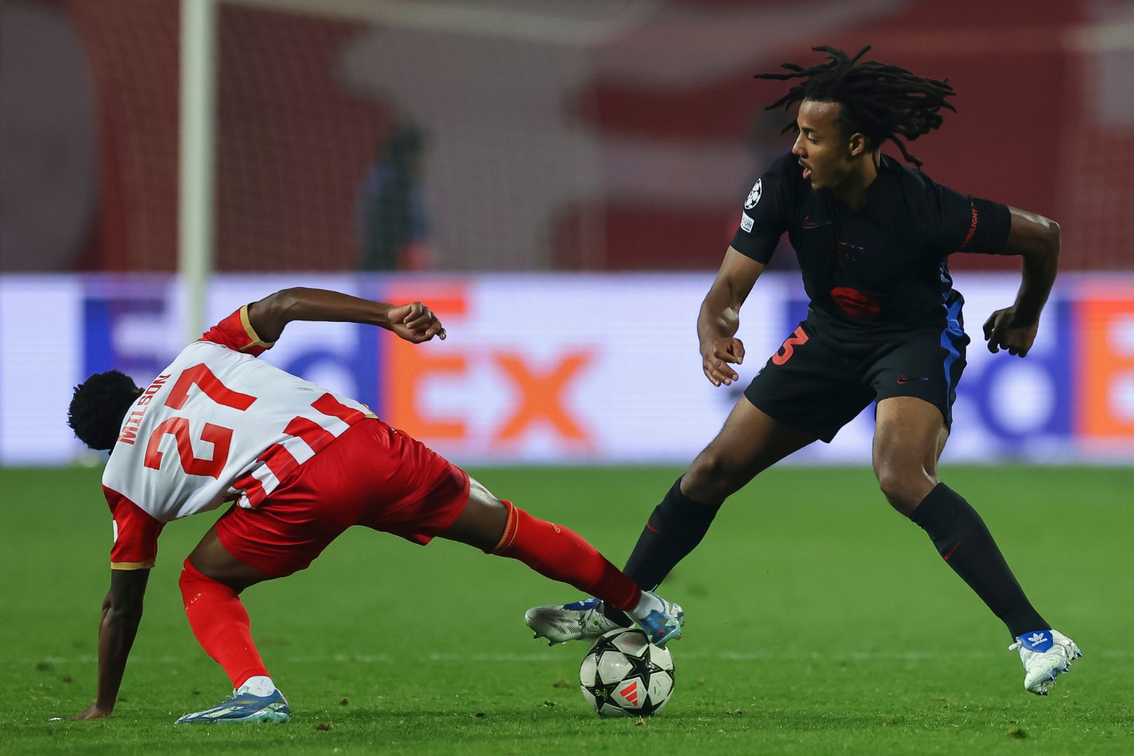 BELGRADE, SERBIA - NOVEMBER 6: Jules Kounde (R) of Barcelona competes for the ball against Felicio Milson (L) of Crvena Zvezda during the UEFA Champions League 2024/25 League Phase MD4 match between FK Crvena Zvezda and FC Barcelona at Stadium Rajko Mitic on November 6, 2024 in Belgrade, Serbia.