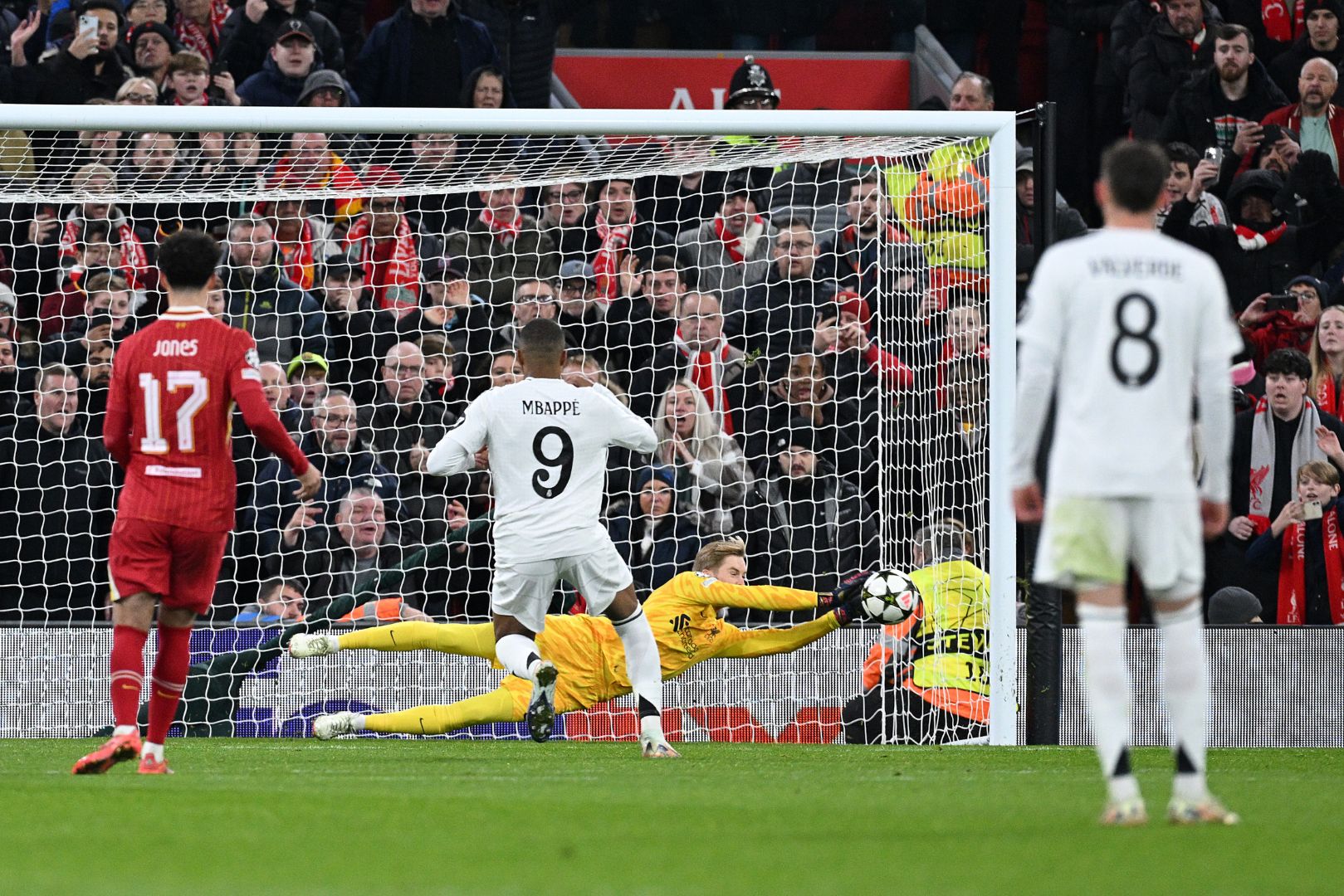 LIVERPOOL, ENGLAND - NOVEMBER 27: Caoimhin Kelleher of Liverpool saves a penalty from Kylian Mbappe of Real Madrid during the UEFA Champions League 2024/25 League Phase MD5 match between Liverpool FC and Real Madrid C.F. at Anfield on November 27, 2024 in Liverpool, England.