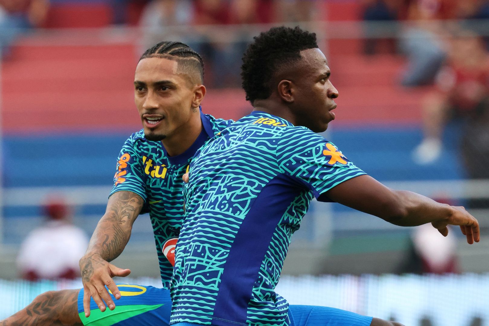 MATURIN, VENEZUELA - NOVEMBER 14: (L-R) Raphinha and Vinicius Junior of Brazil warm up the South American FIFA World Cup 2026 Qualifier match between Venezuela and Brazil at Estadio Monumental de Maturin on November 14, 2024 in Maturin, Venezuela.