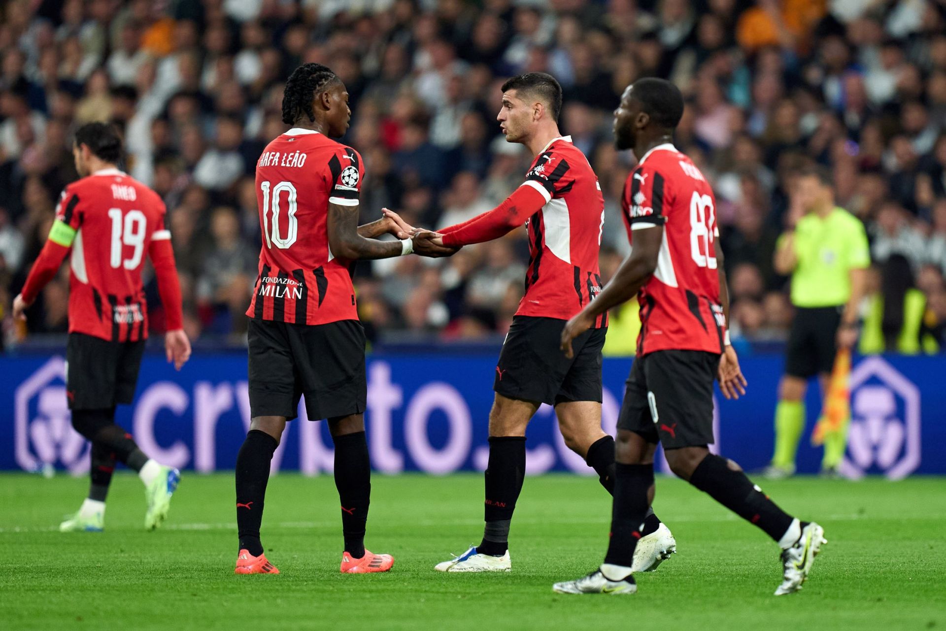MADRID, SPAIN - NOVEMBER 05: Alvaro Morata of AC Milan celebrates with Rafael Leao scoring the team's second goal during the UEFA Champions League 2024/25 League Phase MD4 match between Real Madrid C.F. and AC Milan at Estadio Santiago Bernabeu on November 05, 2024 in Madrid, Spain.