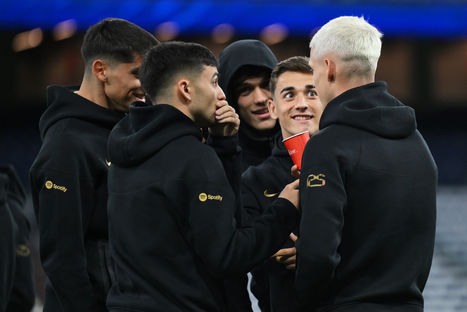MADRID, SPAIN - OCTOBER 26: Pedri and Gavi interact with teammate Dani Olmo of FC Barcelona prior to the LaLiga match between Real Madrid CF and FC Barcelona at Estadio Santiago Bernabeu on October 26, 2024 in Madrid, Spain.
