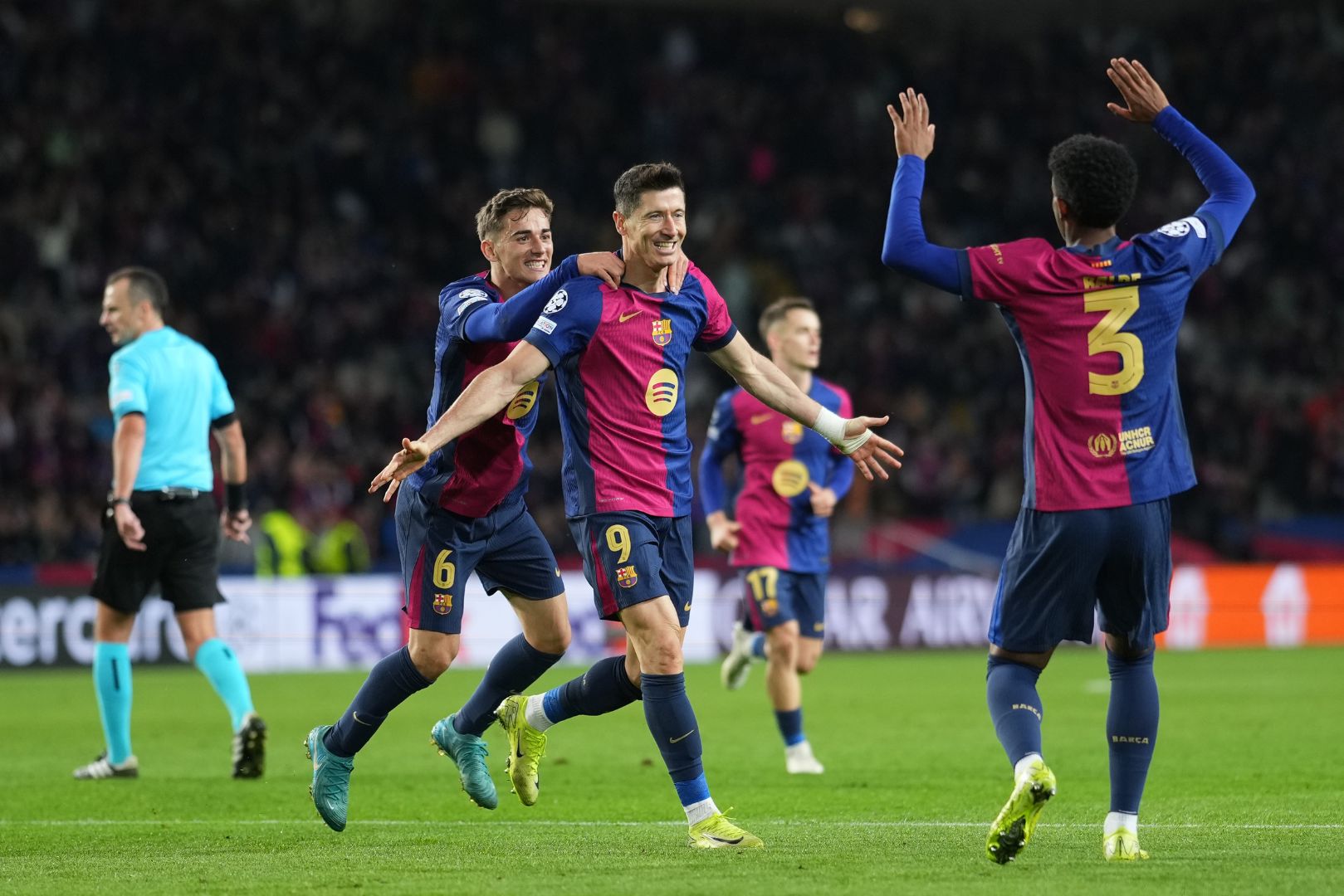 BARCELONA, SPAIN - NOVEMBER 26: Robert Lewandowski of FC Barcelona celebrates scoring his team's third goal with teammates during the UEFA Champions League 2024/25 League Phase MD5 match between FC Barcelona and Stade Brestois 29 at Estadi Olimpic Lluis Companys on November 26, 2024 in Barcelona, Spain.