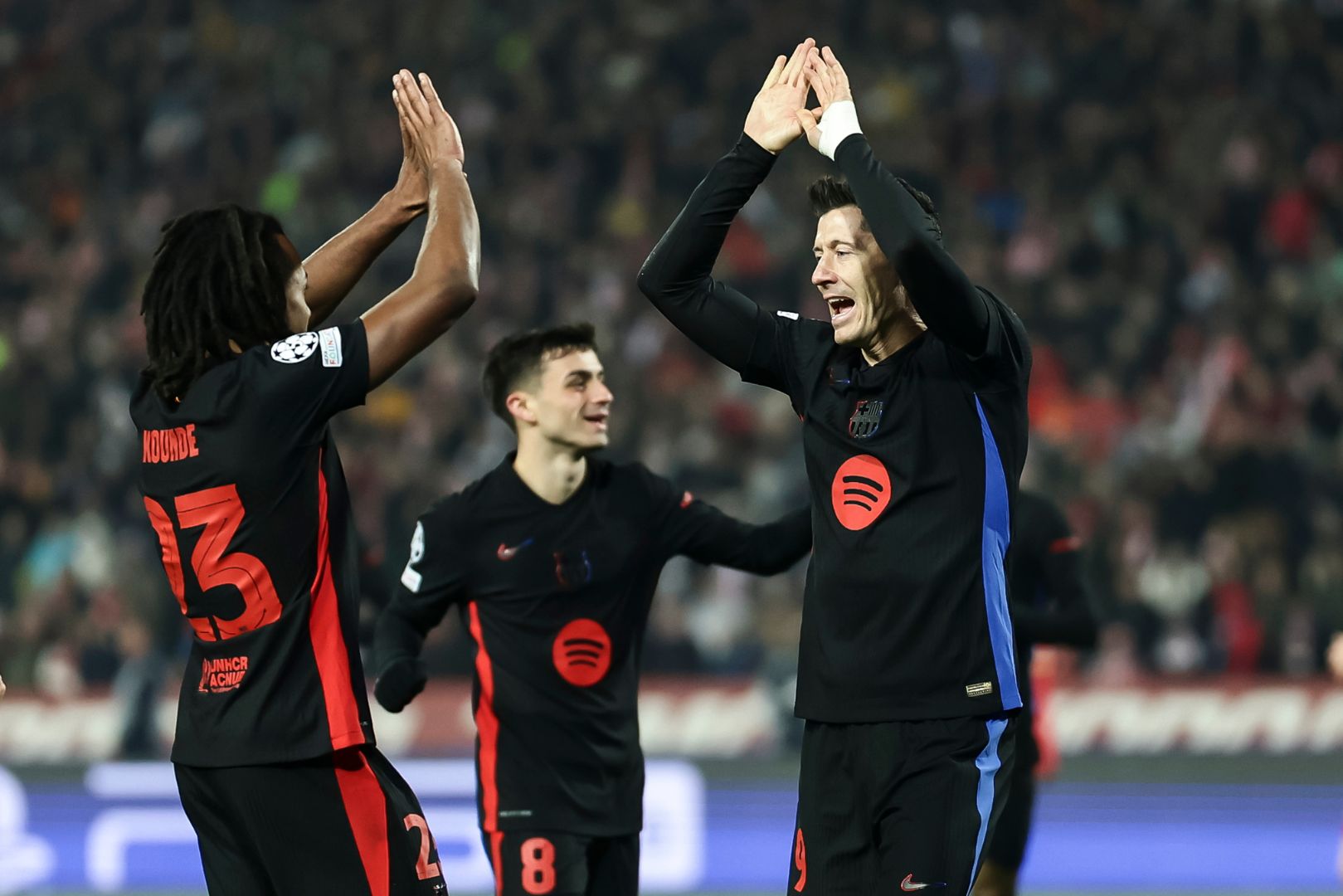 BELGRADE, SERBIA - NOVEMBER 6: Robert Lewandowski (R) of Barcelona celebrates after scoring a goal with Jules Kounde (L) during the UEFA Champions League 2024/25 League Phase MD4 match between FK Crvena Zvezda and FC Barcelona at Stadium Rajko Mitic on November 6, 2024 in Belgrade, Serbia.