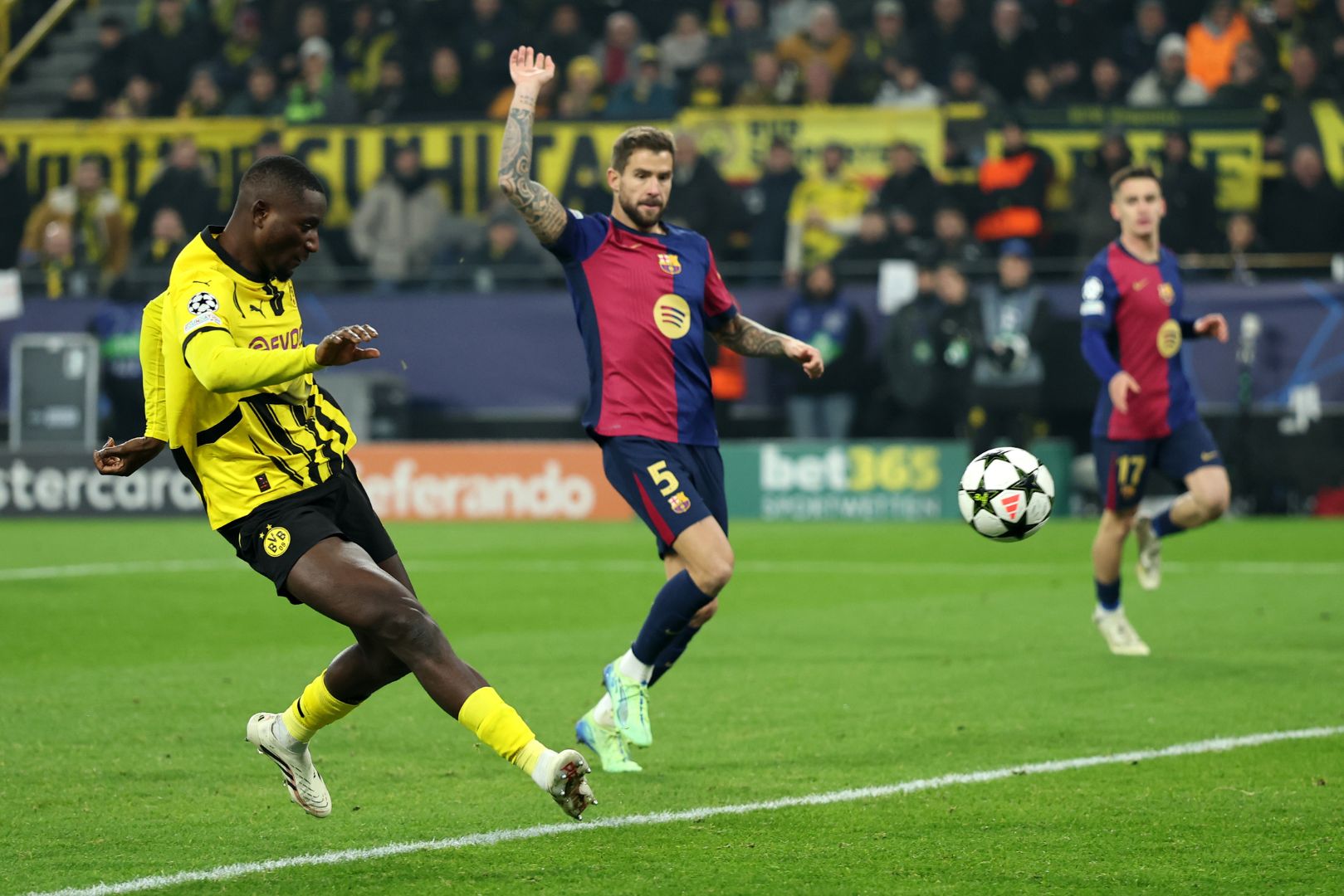 DORTMUND, GERMANY - DECEMBER 11: Serhou Guirassy of Borussia Dortmund scores a goal which was later ruled out during the UEFA Champions League 2024/25 League Phase MD6 match between Borussia Dortmund and FC Barcelona at BVB Stadion Dortmund on December 11, 2024 in Dortmund, Germany.
