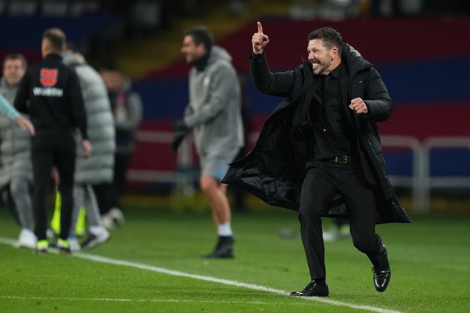 BARCELONA, SPAIN - DECEMBER 21: Diego Simeone, Head Coach of Atletico de Madrid, celebrates after Alexander Sorloth of Atletico de Madrid (not pictured) scored his team's second goal during the LaLiga match between FC Barcelona and Atletico de Madrid at Estadi Olimpic Lluis Companys on December 21, 2024 in Barcelona, Spain.