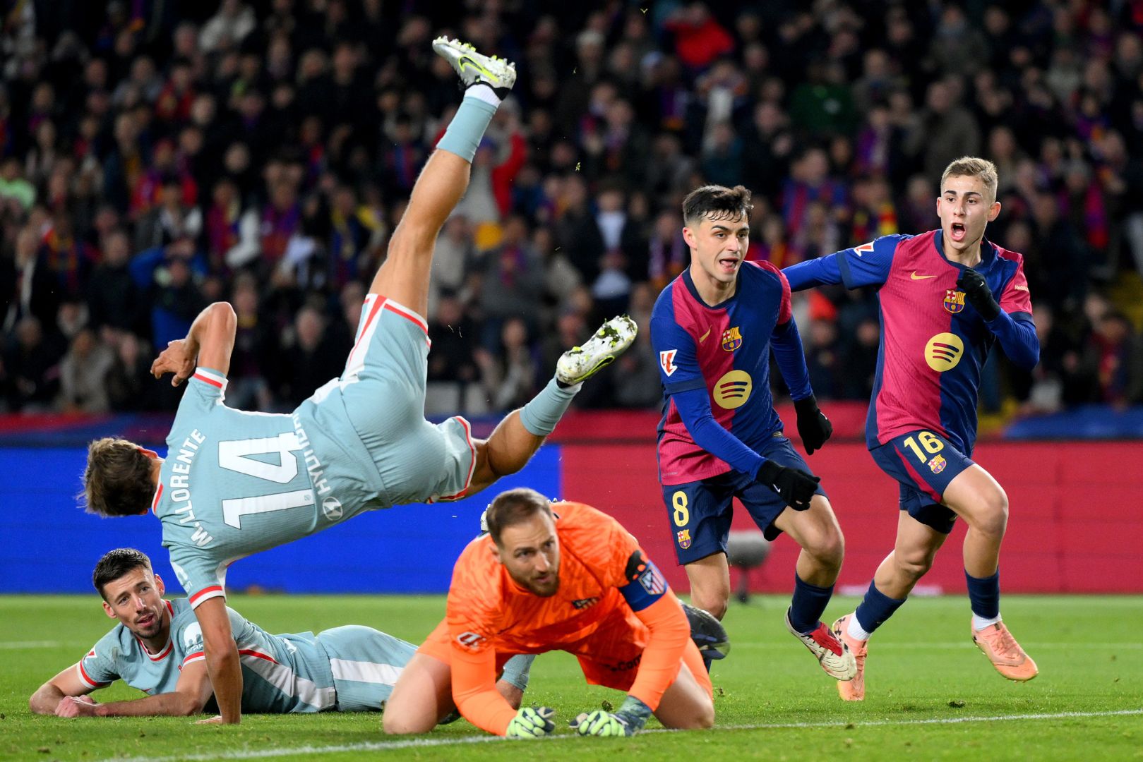 BARCELONA, SPAIN - DECEMBER 21: Pedri of FC Barcelona celebrates scoring his team's first goal during the LaLiga match between FC Barcelona and Atletico de Madrid at Estadi Olimpic Lluis Companys on December 21, 2024 in Barcelona, Spain.