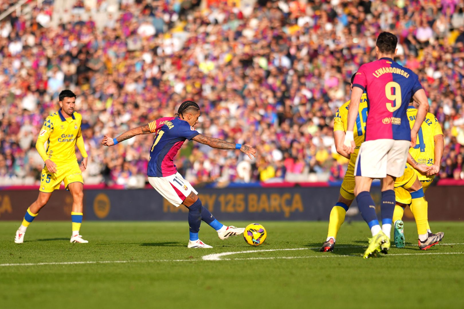 BARCELONA, SPAIN - NOVEMBER 30: Raphinha of FC Barcelona scores his team's first goal during the LaLiga match between FC Barcelona and UD Las Palmas at Estadi Olimpic Lluis Companys on November 30, 2024 in Barcelona, Spain.