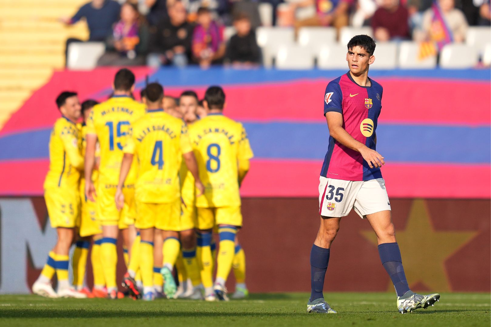 BARCELONA, SPAIN - NOVEMBER 30: Gerard Martin of FC Barcelona looks dejected after Sandro Ramirez of UD Las Palmas (not pictured) scores his team's first goal during the LaLiga match between FC Barcelona and UD Las Palmas at Estadi Olimpic Lluis Companys on November 30, 2024 in Barcelona, Spain.