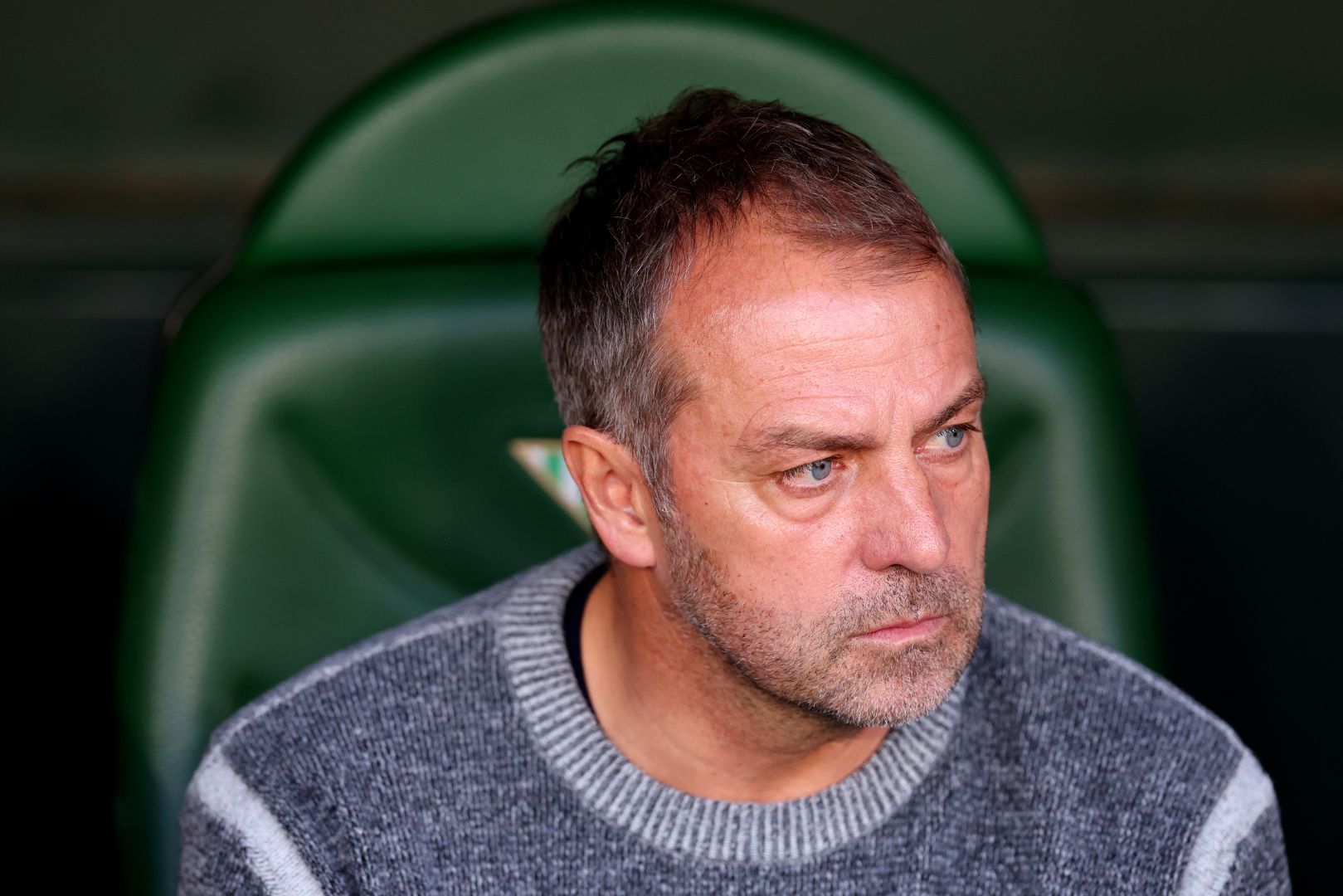 SEVILLE, SPAIN - DECEMBER 07: Hansi Flick, Head Coach of FC Barcelona, looks on prior to the LaLiga match between Real Betis Balompie and FC Barcelona at Estadio Benito Villamarin on December 07, 2024 in Seville, Spain.