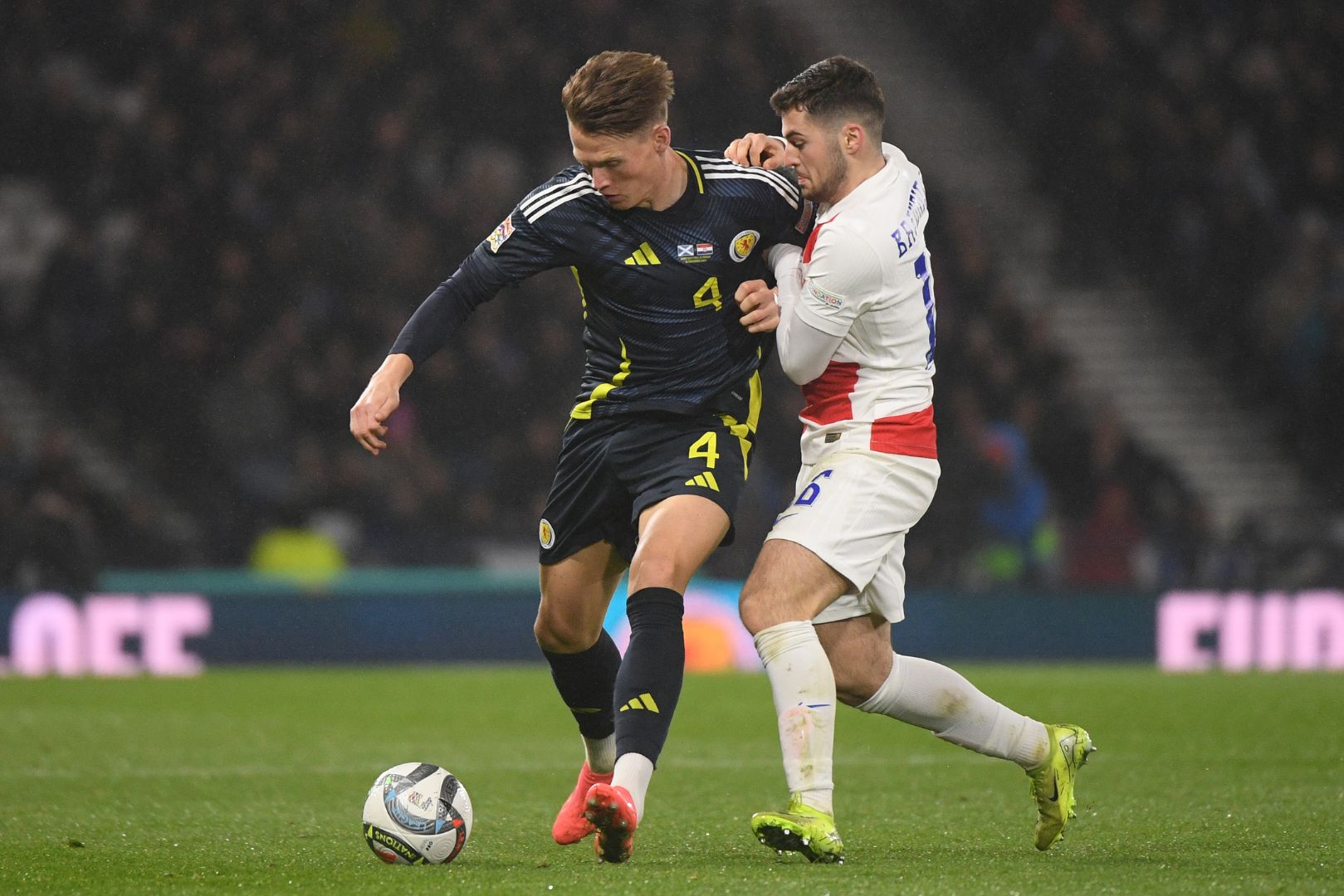 GLASGOW, SCOTLAND - NOVEMBER 15: Scott McTominay of Scotland controls the ball whilst under pressure from Martin Baturina of Croatia during the UEFA Nations League 2024/25 League A Group A1 match between Scotland and Croatia at Hampden Park on November 15, 2024 in Glasgow, Scotland.