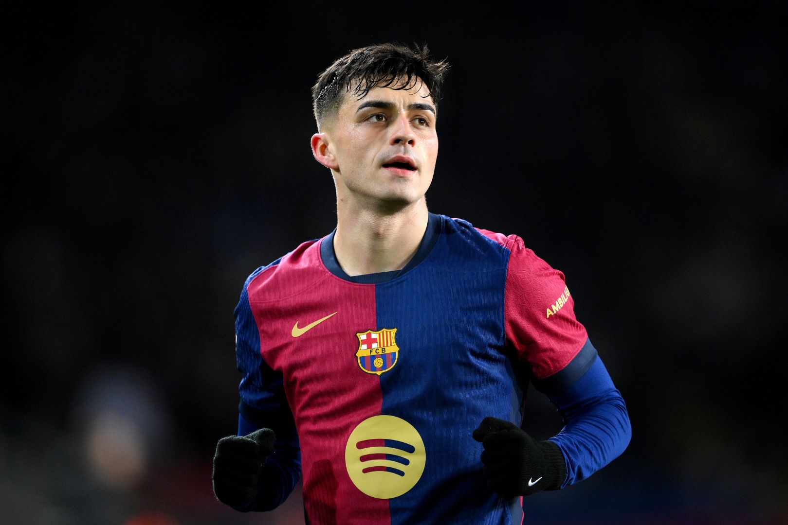 BARCELONA, SPAIN - DECEMBER 21: Pedri of FC Barcelona looks on after scoring his team's first goal during the LaLiga match between FC Barcelona and Atletico de Madrid at Estadi Olimpic Lluis Companys on December 21, 2024 in Barcelona, Spain.