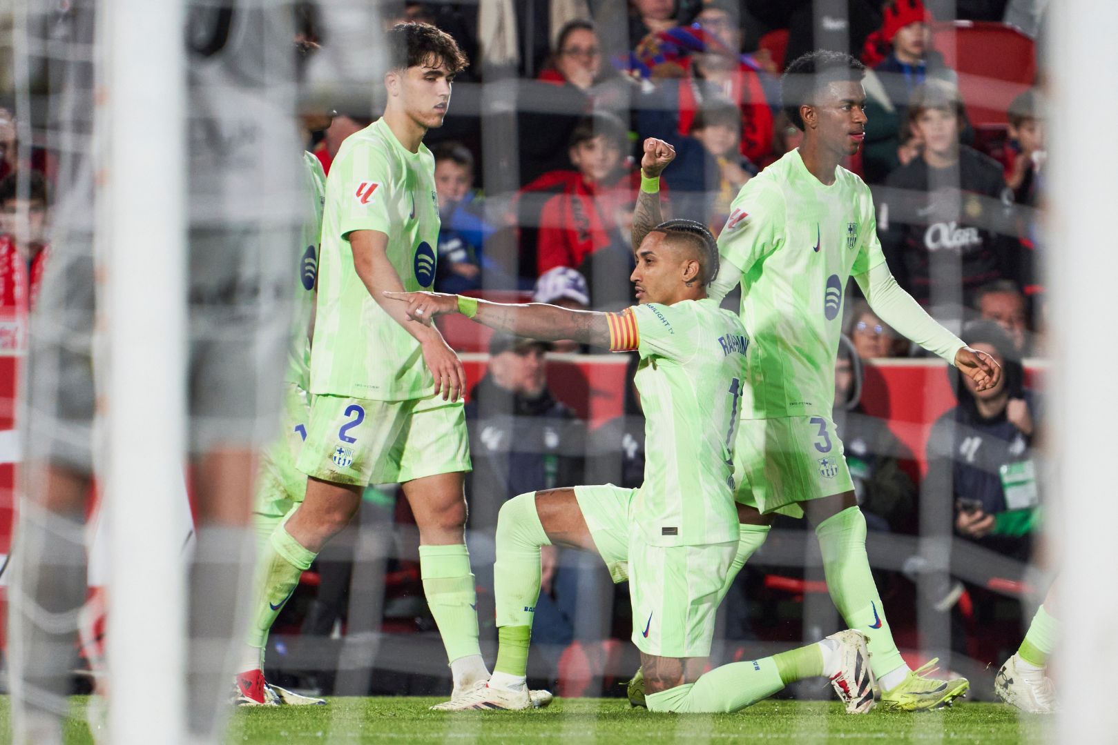 MALLORCA, SPAIN - DECEMBER 03: Raphinha of FC Barcelona celebrates scoring his team´s second goal with teammates during the LaLiga match between RCD Mallorca and FC Barcelona at Estadi de Son Moix on December 03, 2024 in Mallorca, Spain.