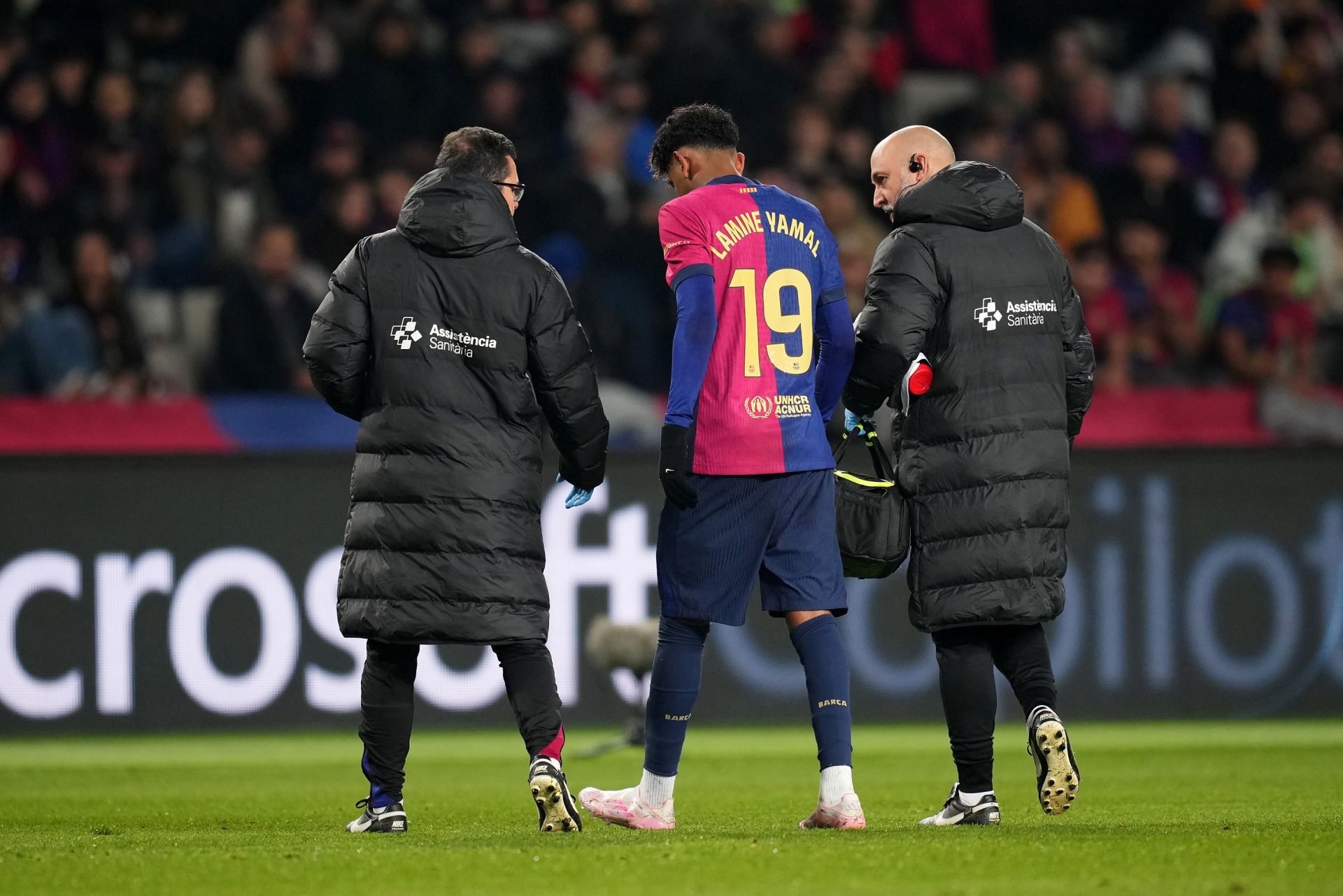 BARCELONA, SPAIN - DECEMBER 15: Lamine Yamal of FC Barcelona makes his way off the field after receiving medical treatement during the LaLiga match between FC Barcelona and CD Leganes at Estadi Olimpic Lluis Companys on December 15, 2024 in Barcelona, Spain.
