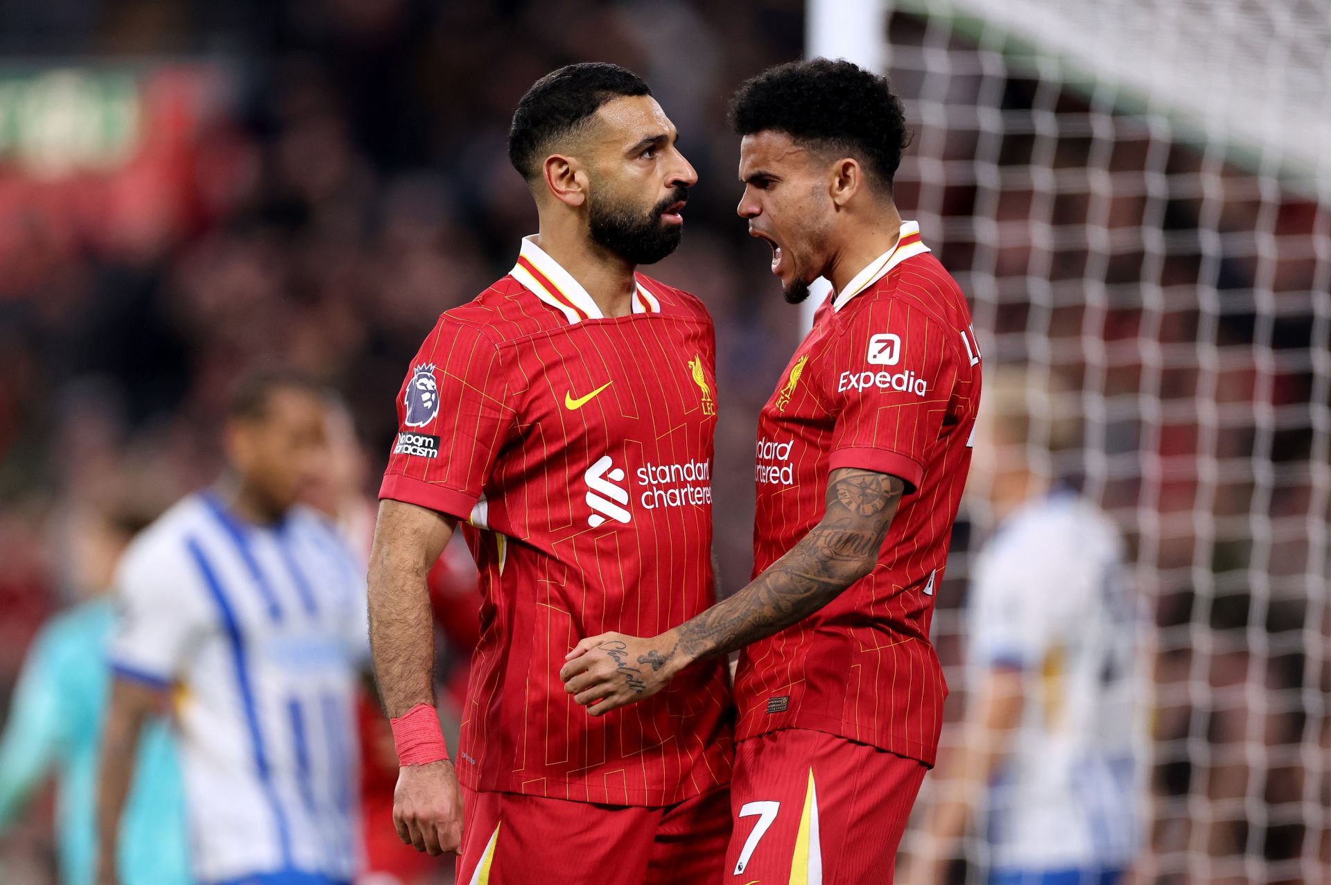 LIVERPOOL, ENGLAND - NOVEMBER 02: Mohamed Salah of Liverpool celebrates scoring his team's second goal with teammate Luis Diaz during the Premier League match between Liverpool FC and Brighton & Hove Albion FC at Anfield on November 02, 2024 in Liverpool, England.