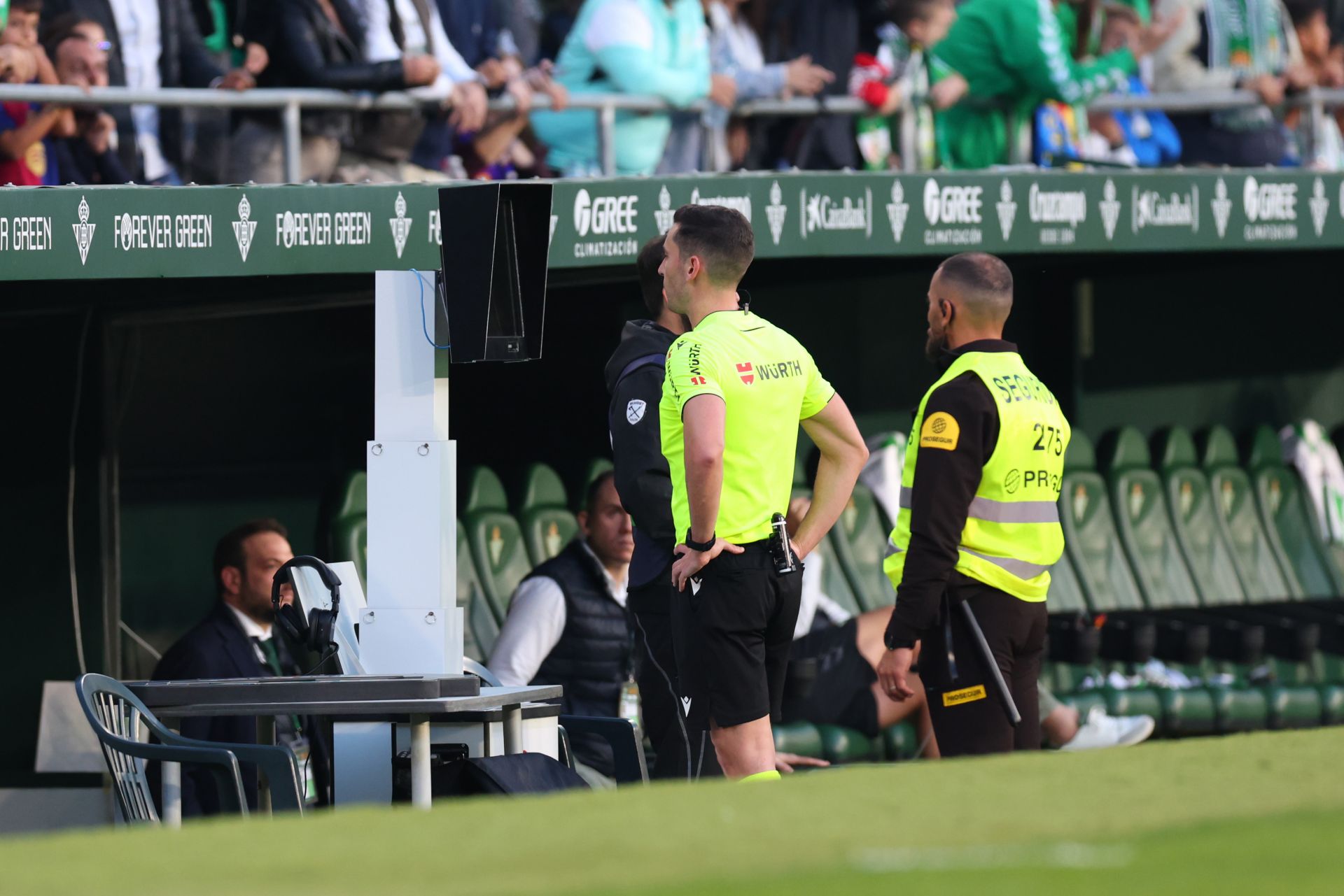 SEVILLE, SPAIN - DECEMBER 07: Referee Alejandro Muniz Ruiz checks the Video Assistant Referee screen during the LaLiga match between Real Betis Balompie and FC Barcelona at Estadio Benito Villamarin on December 07, 2024 in Seville, Spain.