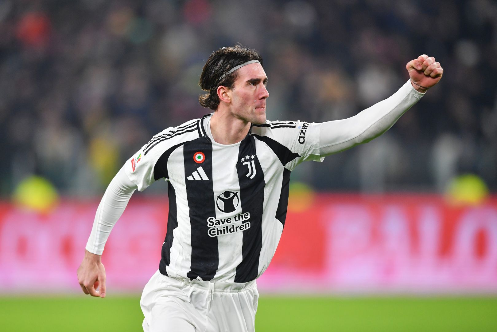TURIN, ITALY - DECEMBER 17: Dusan Vlahovic of Juventus celebrates scoring his team's first goal during the Coppa Italia match between Juventus FC and Cagliari Calcio at Allianz Stadium on December 17, 2024 in Turin, Italy.