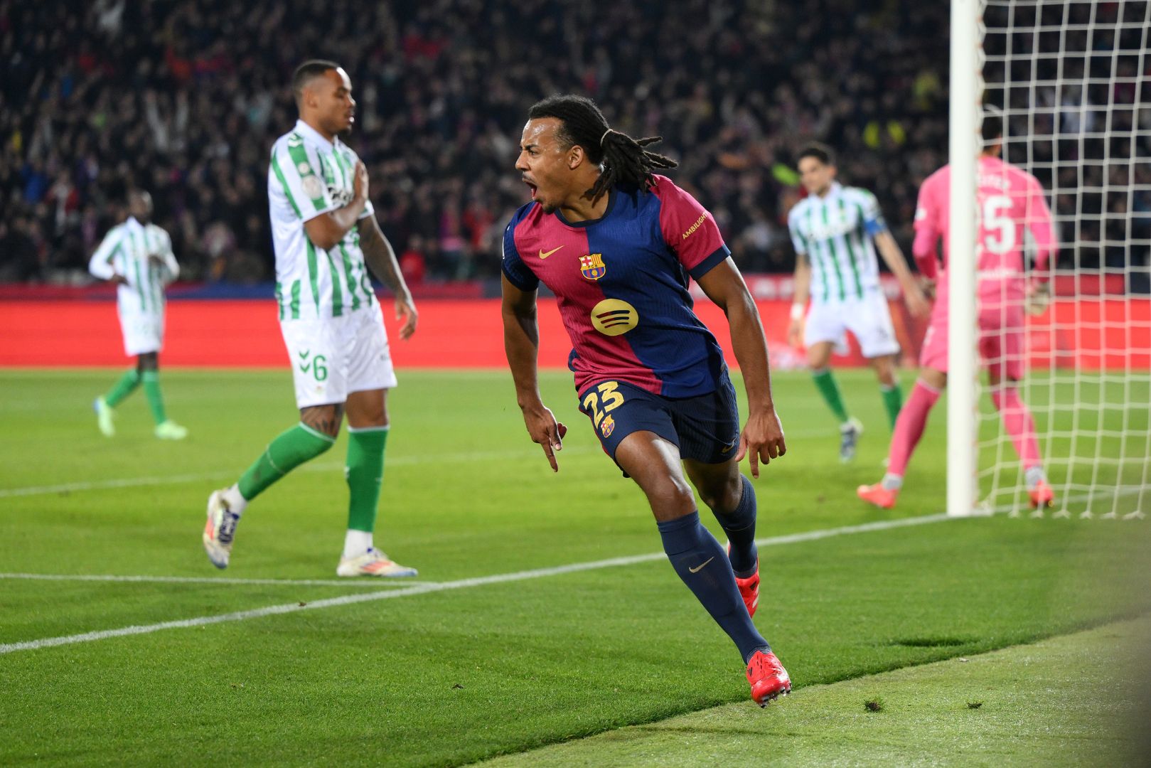 BARCELONA, SPAIN - JANUARY 15: Jules Kounde of FC Barcelona celebrates scoring his team's second goal during the Copa del Rey Round of 16 match between FC Barcelona and Real Betis at Estadi Olimpic Lluis Companys on January 15, 2025 in Barcelona, Spain.