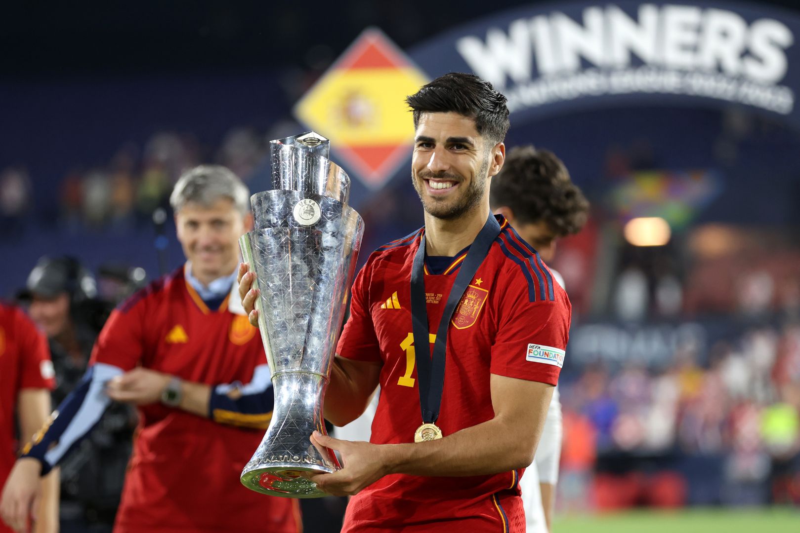 ROTTERDAM, NETHERLANDS - JUNE 18: Marco Asensio of Spain poses for a photograph with the UEFA Nations League trophy after the team's victory in the UEFA Nations League 2022/23 final match between Croatia and Spain at De Kuip on June 18, 2023 in Rotterdam, Netherlands.