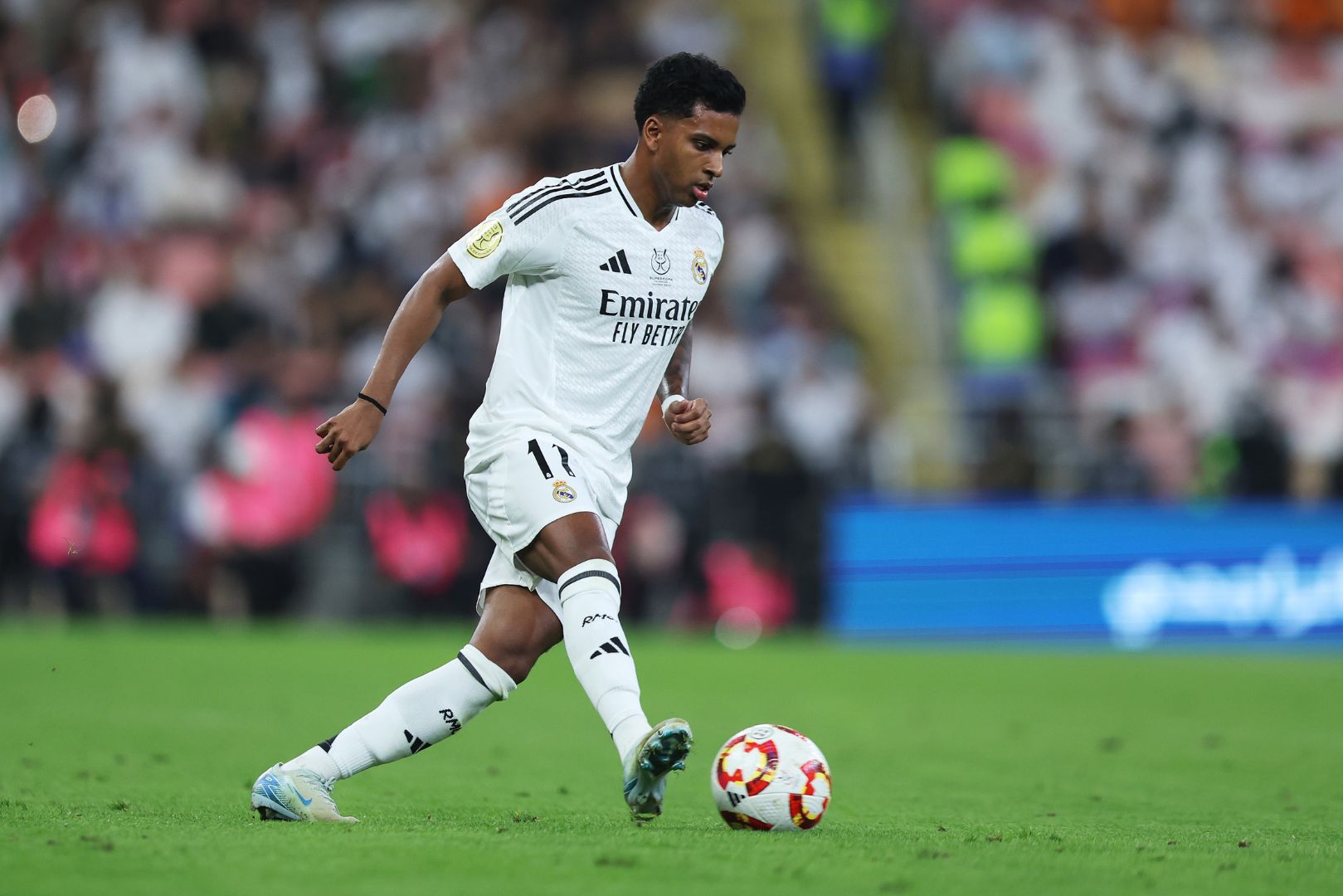 JEDDAH, SAUDI ARABIA - JANUARY 09: Rodrygo of Real Madrid runs with the ball during the Spanish Super Cup Semi-Final match between Real Madrid and RCD Mallorca at King Abdullah Sports City on January 09, 2025 in Jeddah, Saudi Arabia.