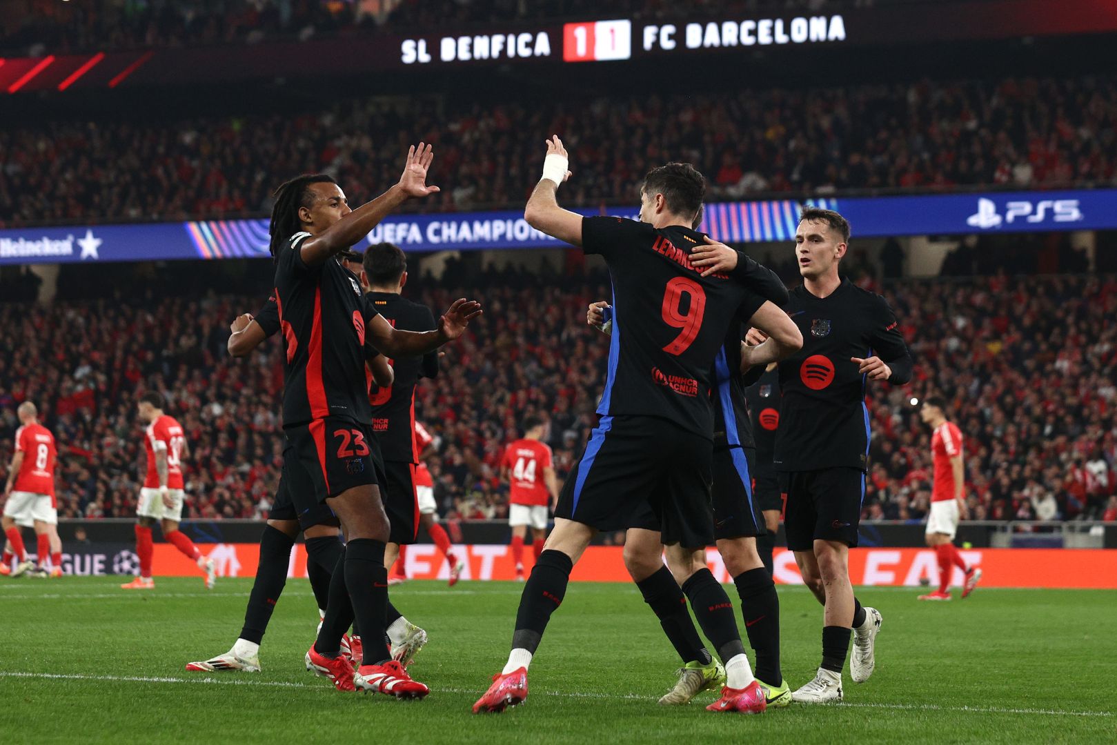 LISBON, PORTUGAL - JANUARY 21: Robert Lewandowski of FC Barcelona celebrates scoring his team's first goal with teammates during the UEFA Champions League 2024/25 League Phase MD7 match between SL Benfica and FC Barcelona at Estadio do SL Benfica on January 21, 2025 in Lisbon, Portugal.