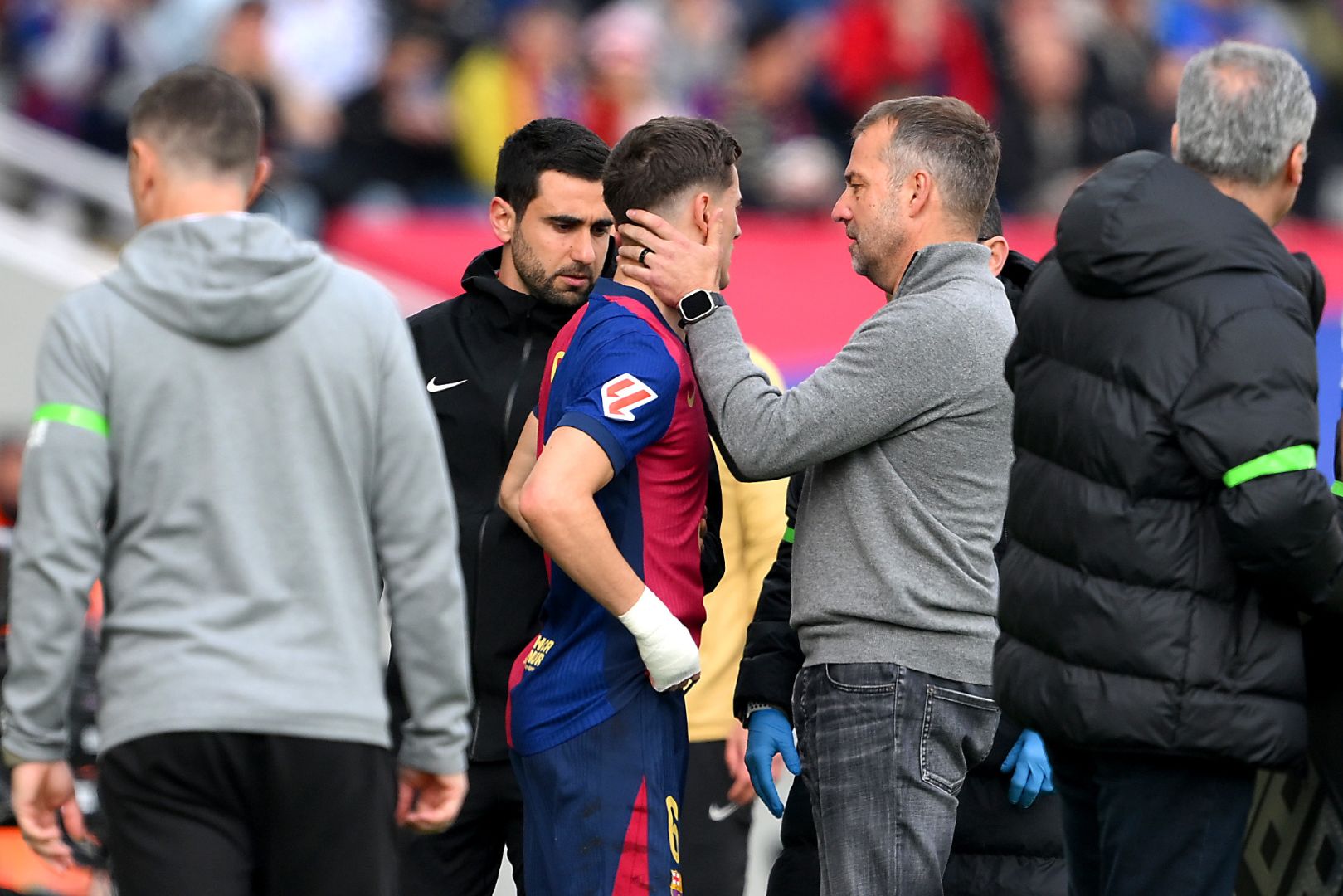 BARCELONA, SPAIN - FEBRUARY 02: Hansi Flick, Head Coach of FC Barcelona, interacts with Gavi of FC Barcelona during the LaLiga match between FC Barcelona and Deportivo Alaves at Estadi Olimpic Lluis Companys on February 02, 2025 in Barcelona, Spain.