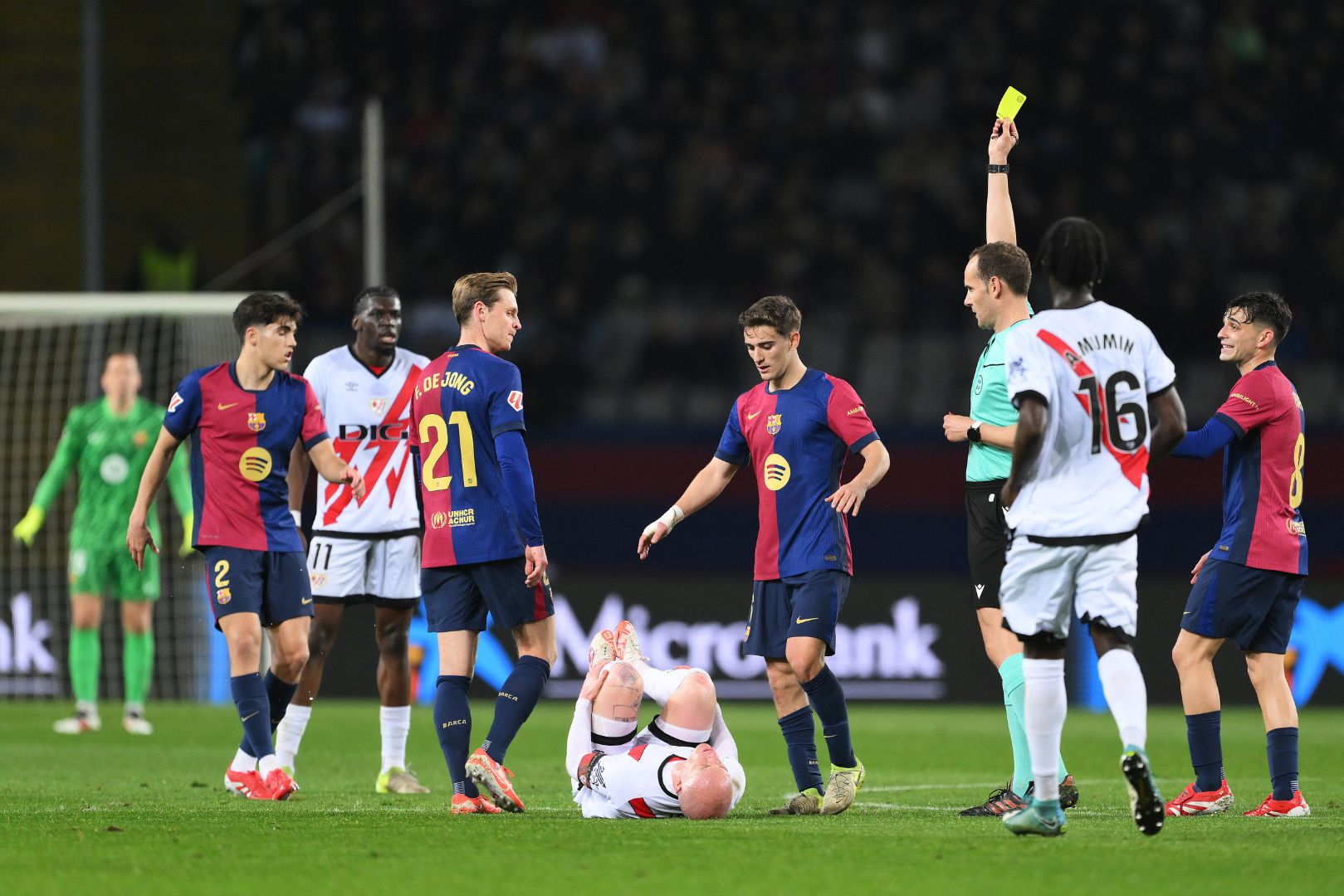 BARCELONA, SPAIN - FEBRUARY 17: Gavi of FC Barcelona is shown a yellow card by Referee Mario Melero Lopez for a foul on Isi Palazon of Rayo Vallecano during the LaLiga match between FC Barcelona and Rayo Vallecano at Estadi Olimpic Lluis Companys on February 17, 2025 in Barcelona, Spain.