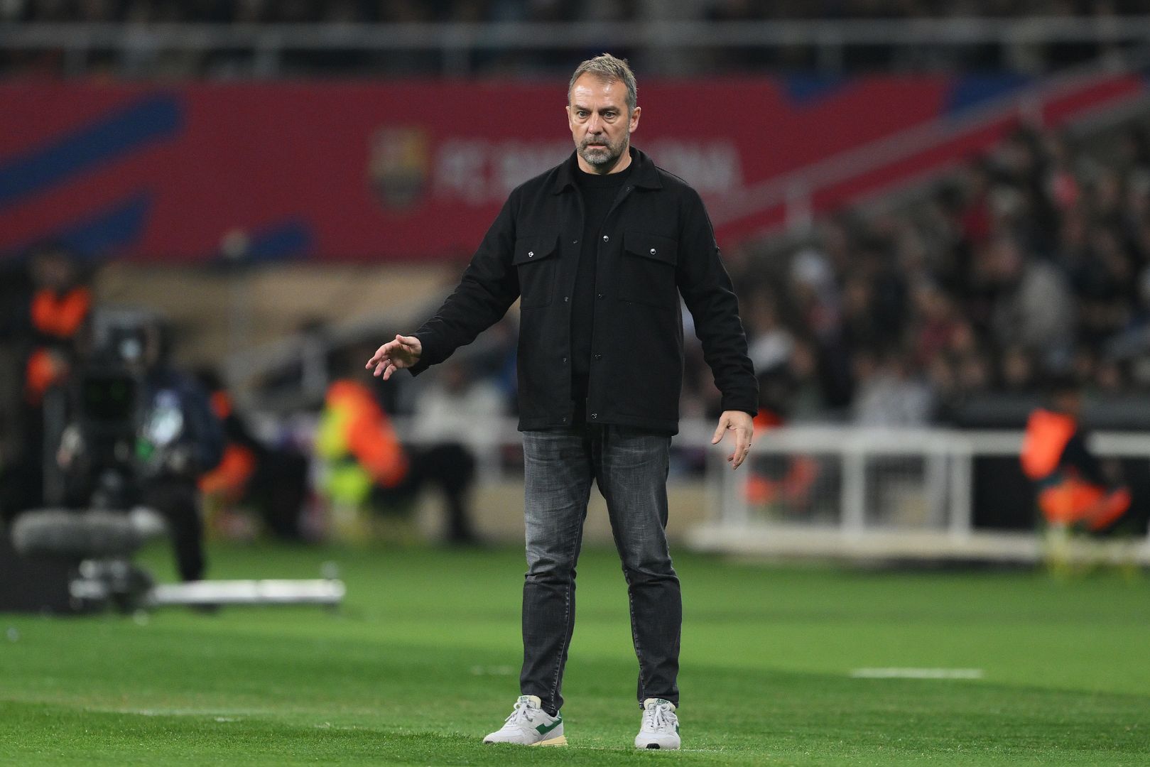 BARCELONA, SPAIN - FEBRUARY 17: Hansi Flick, Head Coach of FC Barcelona, looks on during the LaLiga match between FC Barcelona and Rayo Vallecano at Estadi Olimpic Lluis Companys on February 17, 2025 in Barcelona, Spain.