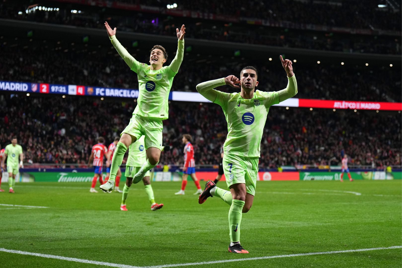 MADRID, SPAIN - MARCH 16: Ferran Torres of FC Barcelona (R) celebrates scoring his team's fourth goal with teammate Gavi during the La Liga EA Sports match between Atletico de Madrid and FC Barcelona at Riyadh Air Metropolitano on March 16, 2025 in Madrid, Spain.