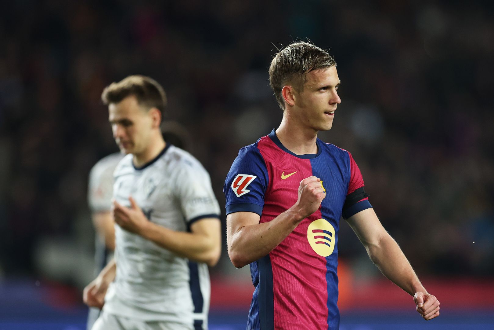 BARCELONA, SPAIN - MARCH 27: Dani Olmo of FC Barcelona celebrates scoring his team's second goal from a penalty retake during the La Liga EA Sports match between FC Barcelona and CA Osasuna at Estadi Olimpic Lluis Companys on March 27, 2025 in Barcelona, Spain.