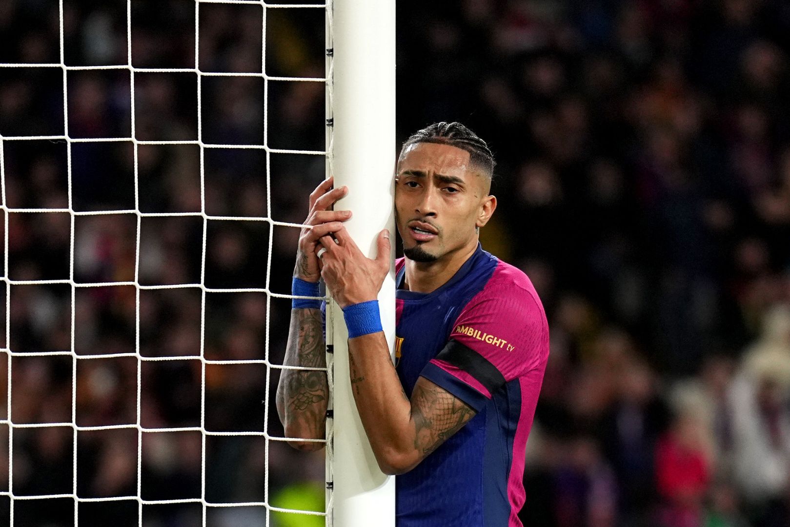 BARCELONA, SPAIN - MARCH 11: Raphinha of FC Barcelona reacts, after missing a chance during the UEFA Champions League 2024/25 UEFA Champions League 2024/25 Round of 16 Second Leg match between FC Barcelona and SL Benfica at Estadi Olímpic Lluís Companys on March 11, 2025 in Barcelona, Spain.