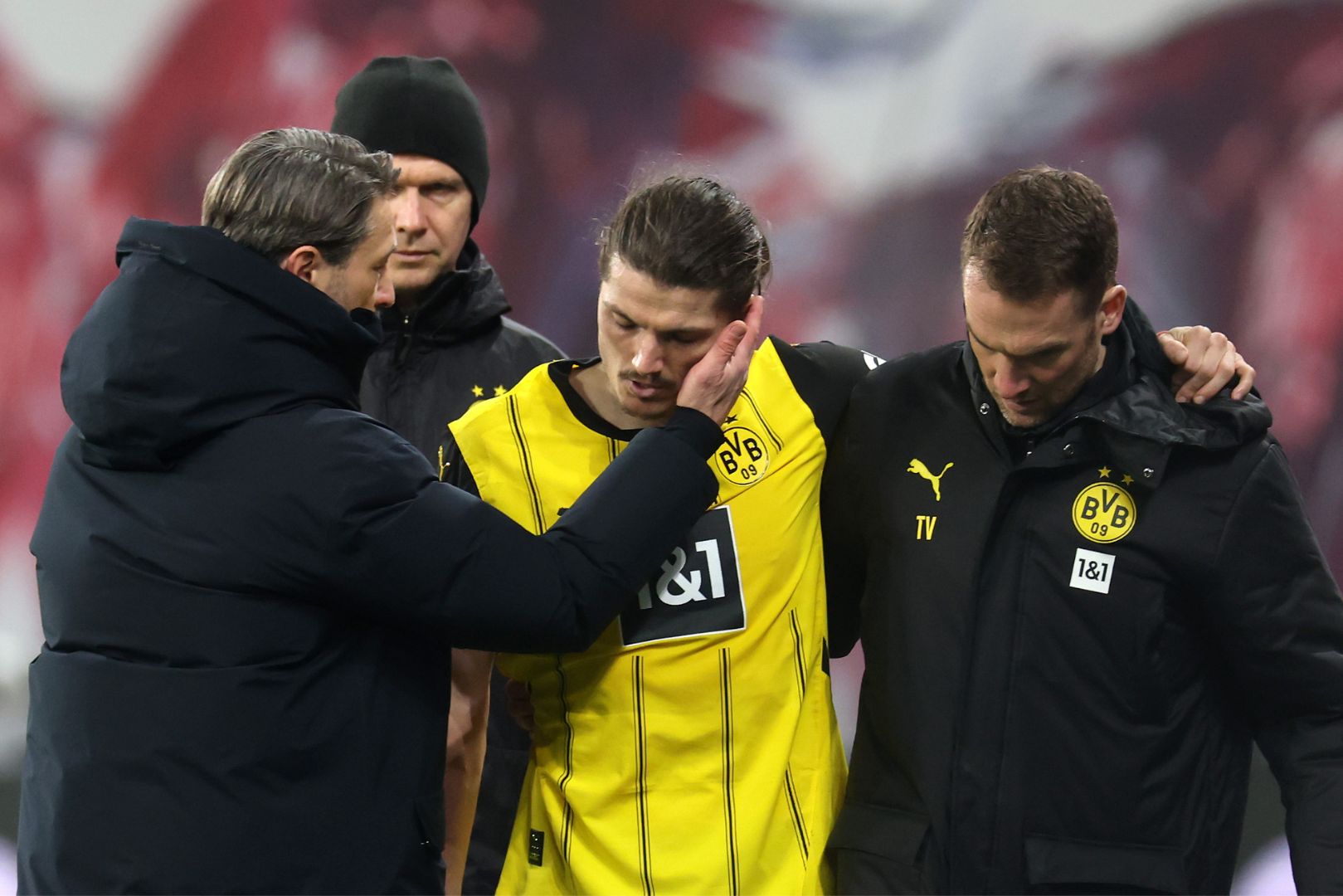 LEIPZIG, GERMANY - MARCH 15: Marcel Sabitzer of Borussia Dortmund is assisted off the pitch by medical staff as he is substituted due to injury during the Bundesliga match between RB Leipzig and Borussia Dortmund at Red Bull Arena on March 15, 2025 in Leipzig, Germany.