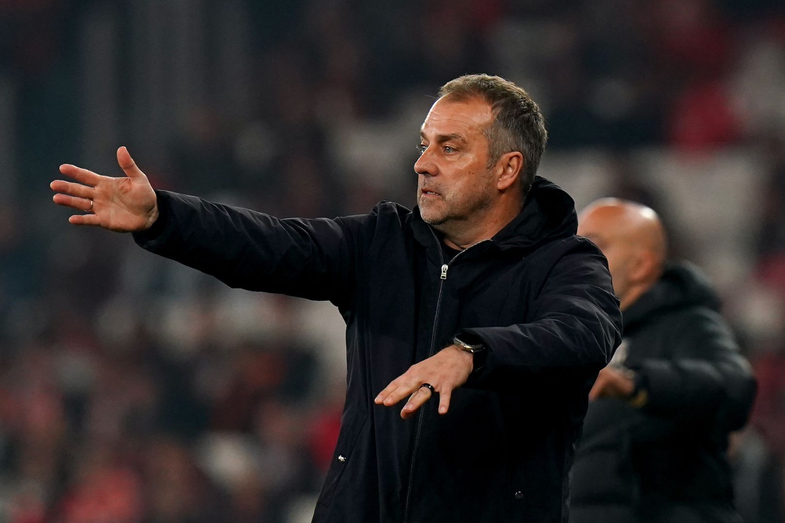 LISBON, PORTUGAL - MARCH 05: Hansi Flick, Head Coach of FC Barcelona, gestures during the UEFA Champions League 2024/25 Round of 16 first Leg match between SL Benfica and FC Barcelona at Estadio da Luz on March 05, 2025 in Lisbon, Portugal.
