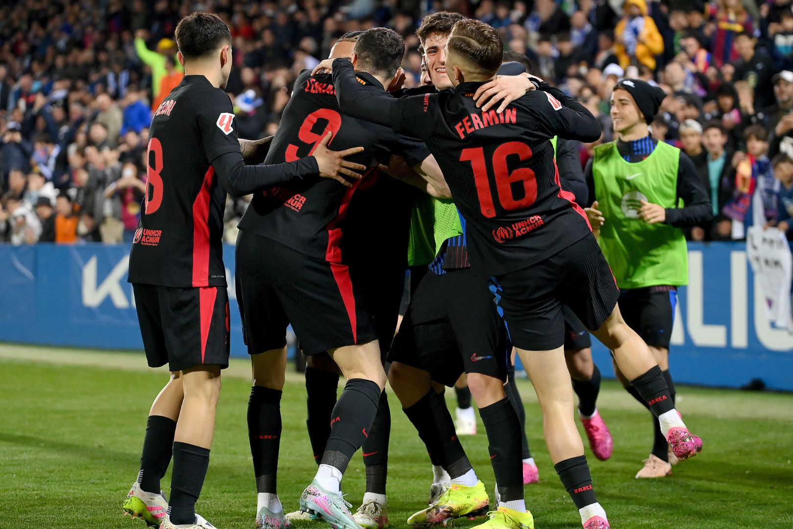 LEGANES, SPAIN - APRIL 12: Robert Lewandowski of FC Barcelona (hidden) celebrates scoring his team's first goal with teammates during the LaLiga match between CD Leganes and FC Barcelona at Estadio Municipal de Butarque on April 12, 2025 in Leganes, Spain.