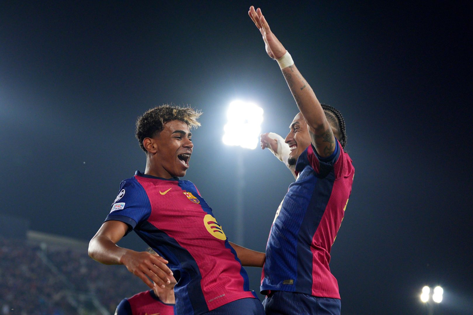 BARCELONA, SPAIN - APRIL 09: Lamine Yamal of FC Barcelona (L) celebrates scoring his team's fourth goal with teammate Raphinha (R) during the UEFA Champions League 2024/25 Quarter Final First Leg match between FC Barcelona and Borussia Dortmund at Estadi Olimpic Lluis Companys on April 09, 2025 in Barcelona, Spain.