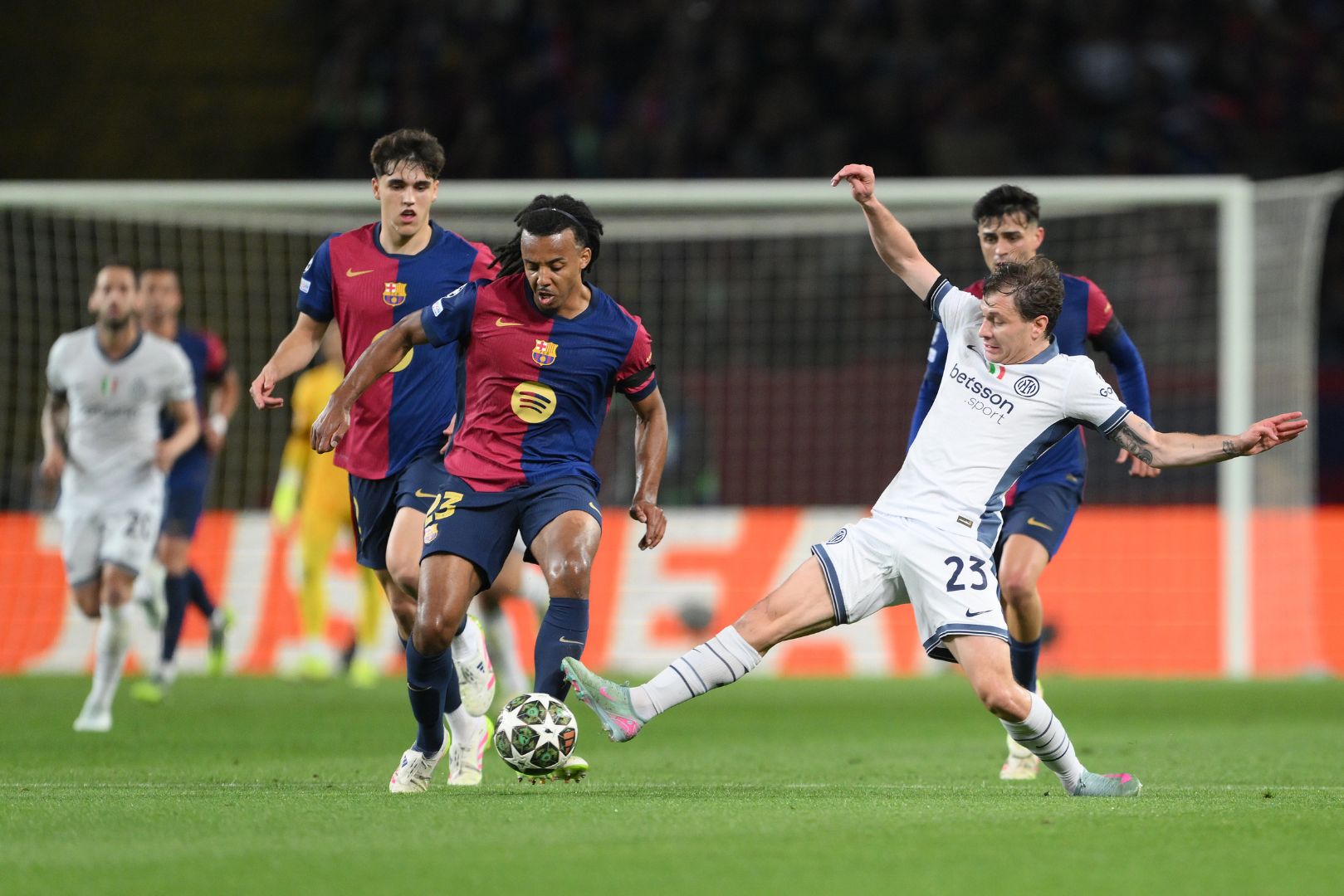 BARCELONA, SPAIN - APRIL 30: Jules Kounde of FC Barcelona is challenged by Nicolo Barella of FC Internazionale during the UEFA Champions League 2024/25 Semi Final First Leg match between FC Barcelona and FC Internazionale Milano at Estadi Olimpic Lluis Companys on April 30, 2025 in Barcelona, Spain.