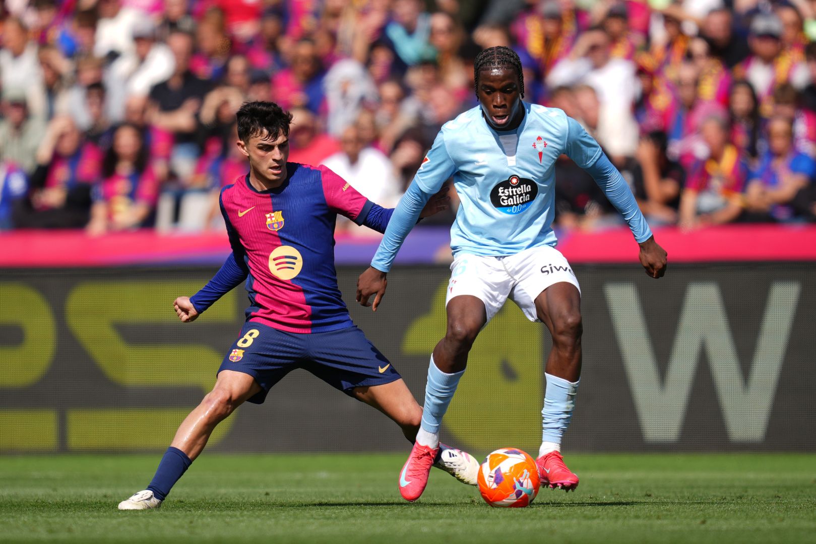 BARCELONA, SPAIN - APRIL 19: Pedri of FC Barcelona challenges Ilaix Moriba of Celta Vigo during the La Liga match between FC Barcelona and RC Celta de Vigo at Estadi Olimpic Lluis Companys on April 19, 2025 in Barcelona, Spain.