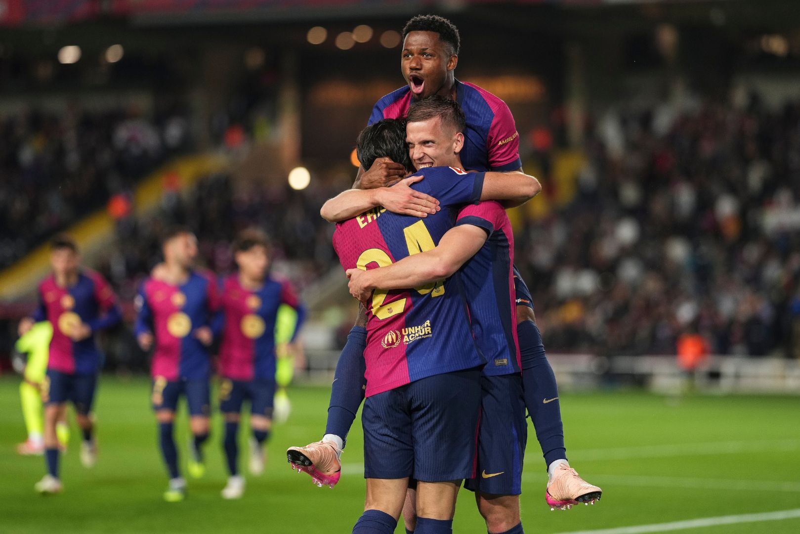 BARCELONA, SPAIN - APRIL 22: Dani Olmo of FC Barcelona celebrates with team mates after scoring the team's first goal during the La Liga EA Sports match between FC Barcelona and RCD Mallorca at Estadi Olimpic Lluis Companys on April 22, 2025 in Barcelona, Spain.
