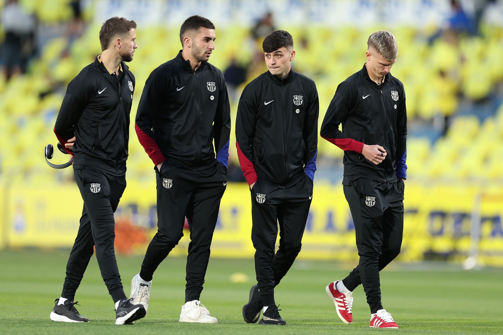 LAS PALMAS, SPAIN - FEBRUARY 22: Inigo Martinez, Ferran Torres, Pedri and Dani Olmo of FC Barcelona interact during a pitch inspection prior to the LaLiga match between UD Las Palmas and FC Barcelona at Estadio Gran Canaria on February 22, 2025 in Las Palmas, Spain.