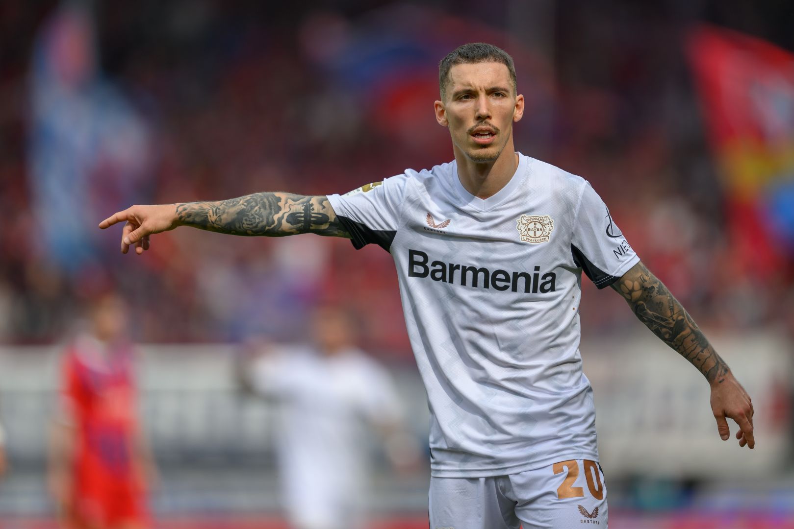 HEIDENHEIM, GERMANY - APRIL 05: Alejandro Grimaldo of Bayer 04 Leverkusen gestures during the Bundesliga match between 1. FC Heidenheim 1846 and Bayer 04 Leverkusen at Voith-Arena on April 05, 2025 in Heidenheim, Germany.