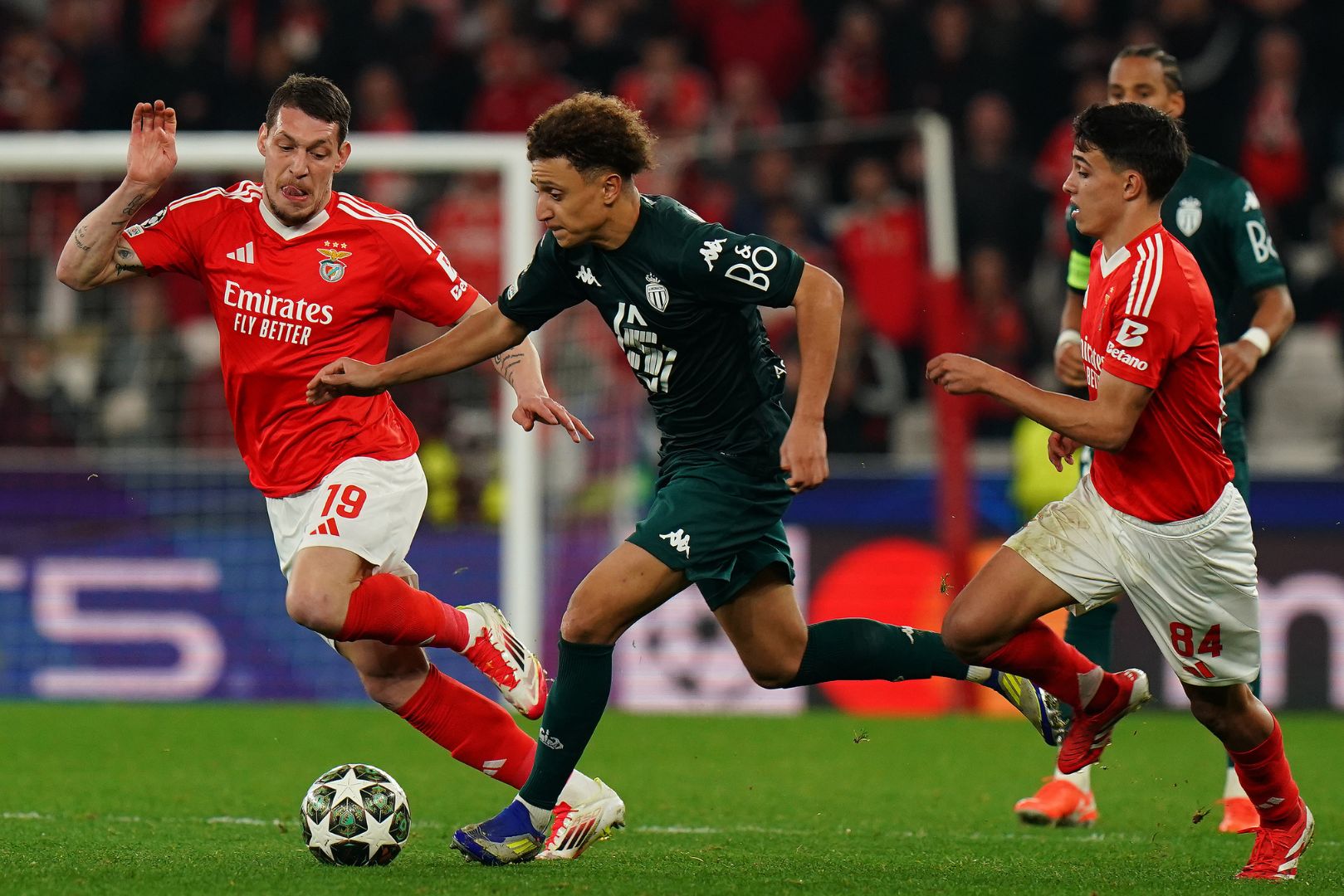 LISBON, PORTUGAL - FEBRUARY 18: Eliesse Ben Seghir of AS Monaco with Andrea Belotti of SL Benfica and Joao Rego of SL Benfica in action during the UEFA Champions League 2024/25 League Knockout Play-off Second Leg match between SL Benfica and AS Monaco at Estadio da Luz on February 18, 2025 in Lisbon, Portugal.