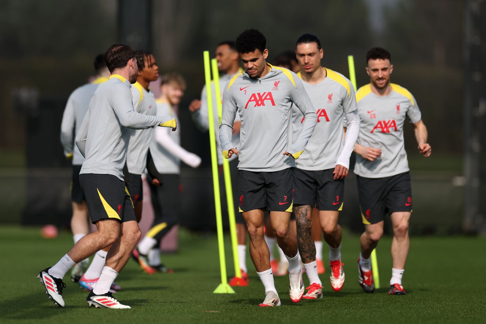 LIVERPOOL, ENGLAND - MARCH 10: Luis Diaz of Liverpool warms up during a training session and press conference ahead of their UEFA Champions League 2024/25 round of 16 second leg match at AXA Melwood Training Centre on March 10, 2025 in Liverpool, England.
