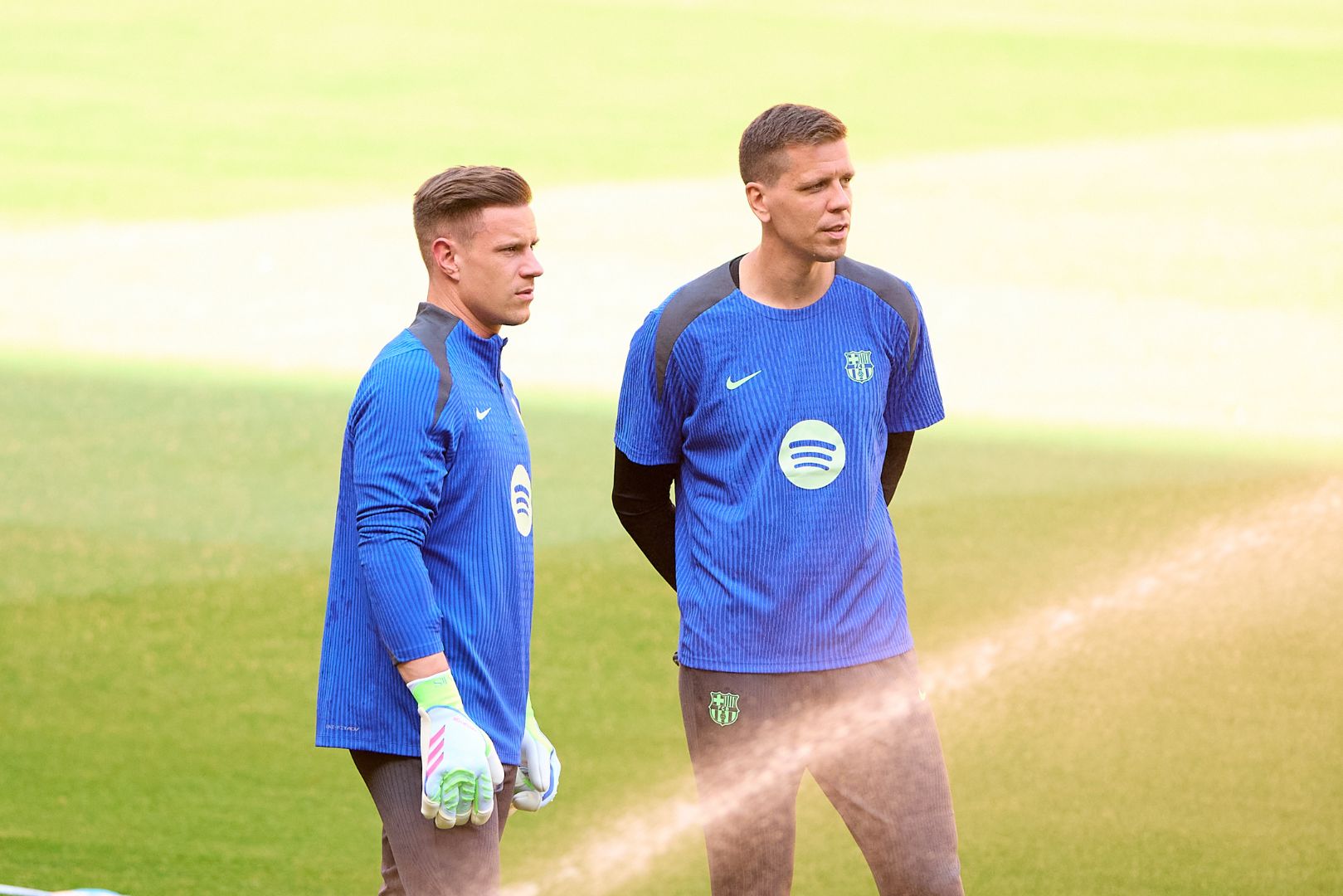 Wojciech Szczęsny and Marc Andre Ter Stegen of FC Barcelona look on during a training session.