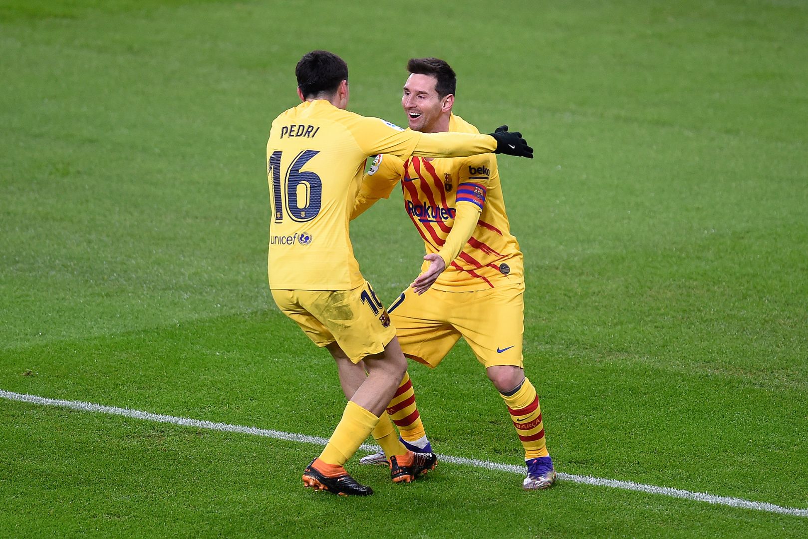BILBAO, SPAIN - JANUARY 06: Lionel Messi of Barcelona celebrates with Pedri of Barcelona after he scores his team's second goal during the La Liga Santander match between Athletic Club and FC Barcelona at Estadio de San Mames on January 06, 2021 in Bilbao, Spain. Sporting stadiums around Spain remain under strict restrictions due to the Coronavirus Pandemic as Government social distancing laws prohibit fans inside venues resulting in games being played behind closed doors.