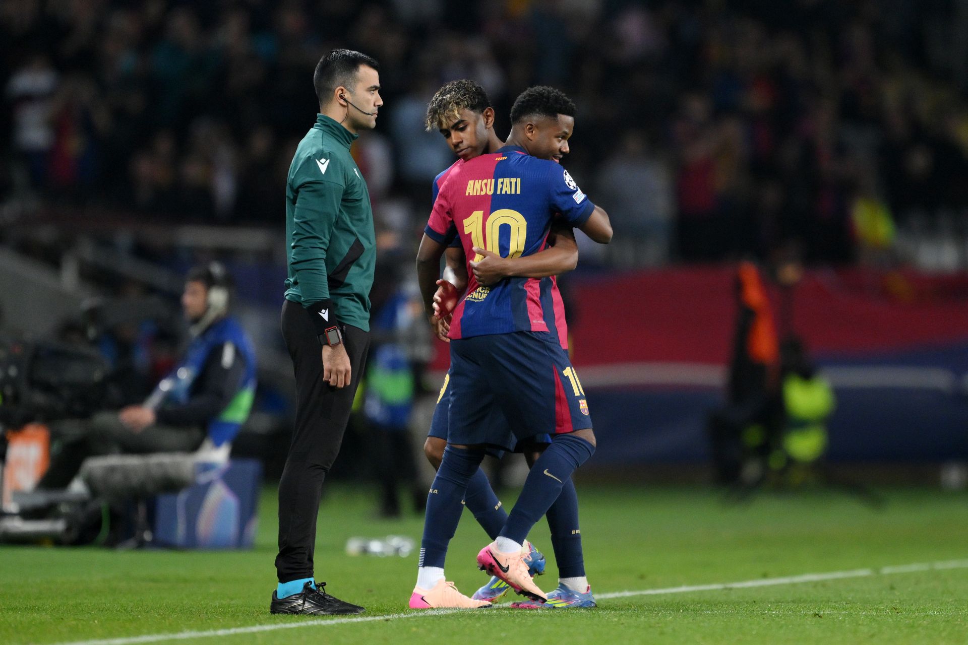 BARCELONA, SPAIN - APRIL 09: Ansu Fati of FC Barcelona high fives team mate Lamine Yamal as he is substituted on to make his return following injury during the UEFA Champions League 2024/25 Quarter Final First Leg match between FC Barcelona and Borussia Dortmund at Estadi Olimpic Lluis Companys on April 09, 2025 in Barcelona, Spain.