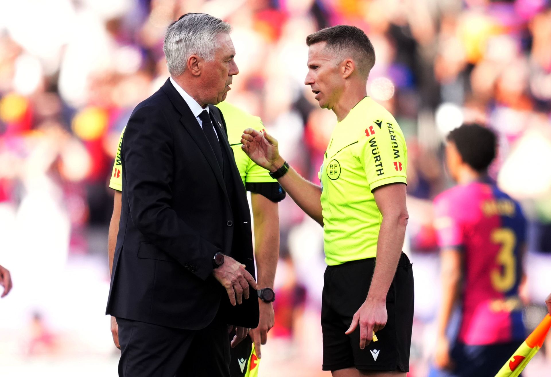 BARCELONA, SPAIN - MAY 11: Carlo Ancelotti, Head Coach of Real Madrid, interacts with referee Alejandro Jose Hernandez Hernandez after his teams 4-3 defeat in the LaLiga match between FC Barcelona and Real Madrid CF at Estadi Olimpic Lluis Companys on May 11, 2025 in Barcelona, Spain.