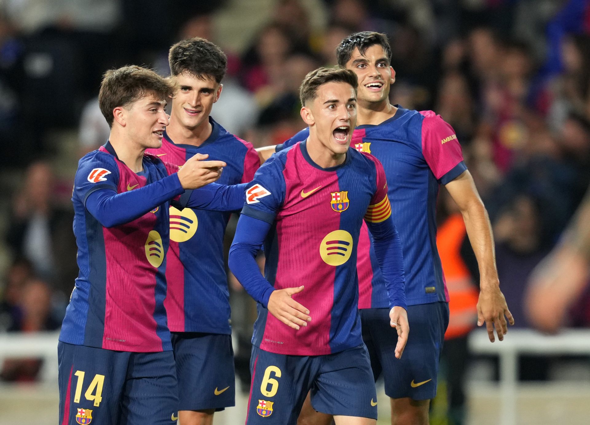 BARCELONA, SPAIN - OCTOBER 20: Pablo Torre of FC Barcelona celebrates with teammates after scoring his team's fifth goal during the La Liga EA Sports match between FC Barcelona and Sevilla FC at Estadi Olimpic Lluis Companys on October 20, 2024 in Barcelona, Spain.
