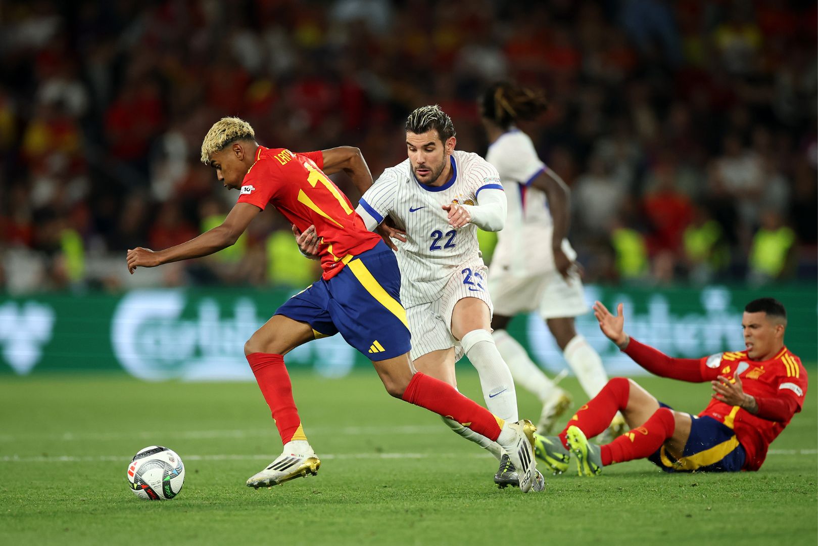 STUTTGART, GERMANY - JUNE 05: Lamine Yamal of Spain is challenged by Theo Hernandez of France during the UEFA Nations League 2025 semifinal match between Spain and France at Stuttgart Arena on June 05, 2025 in Stuttgart, Germany.