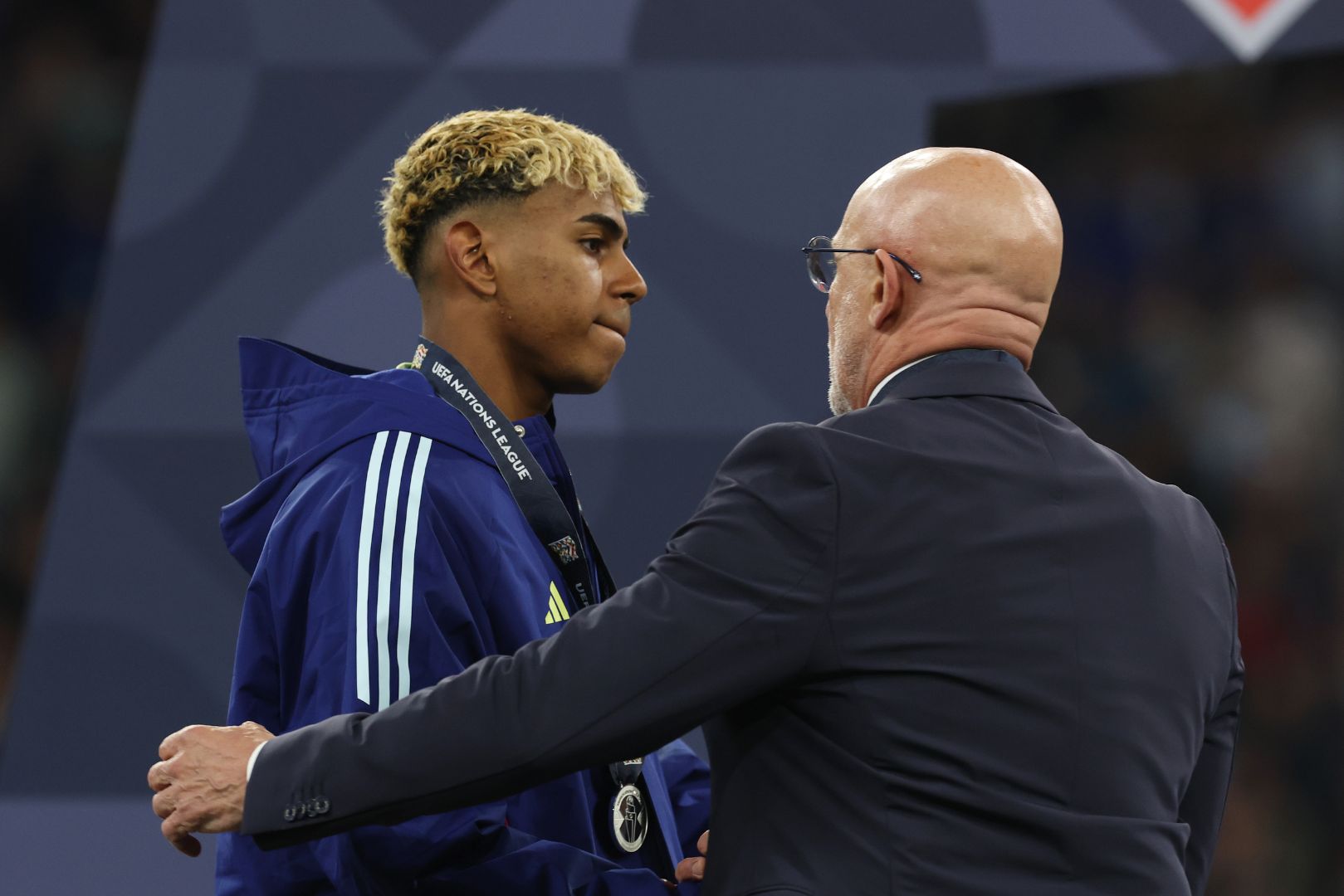 MUNICH, GERMANY - JUNE 08: Lamine Yamal of Spain appears dejected as he collects his runners up medal following defeat in the UEFA Nations League 2025 final match between Portugal and Spain at Munich Football Arena on June 08, 2025 in Munich, Germany.