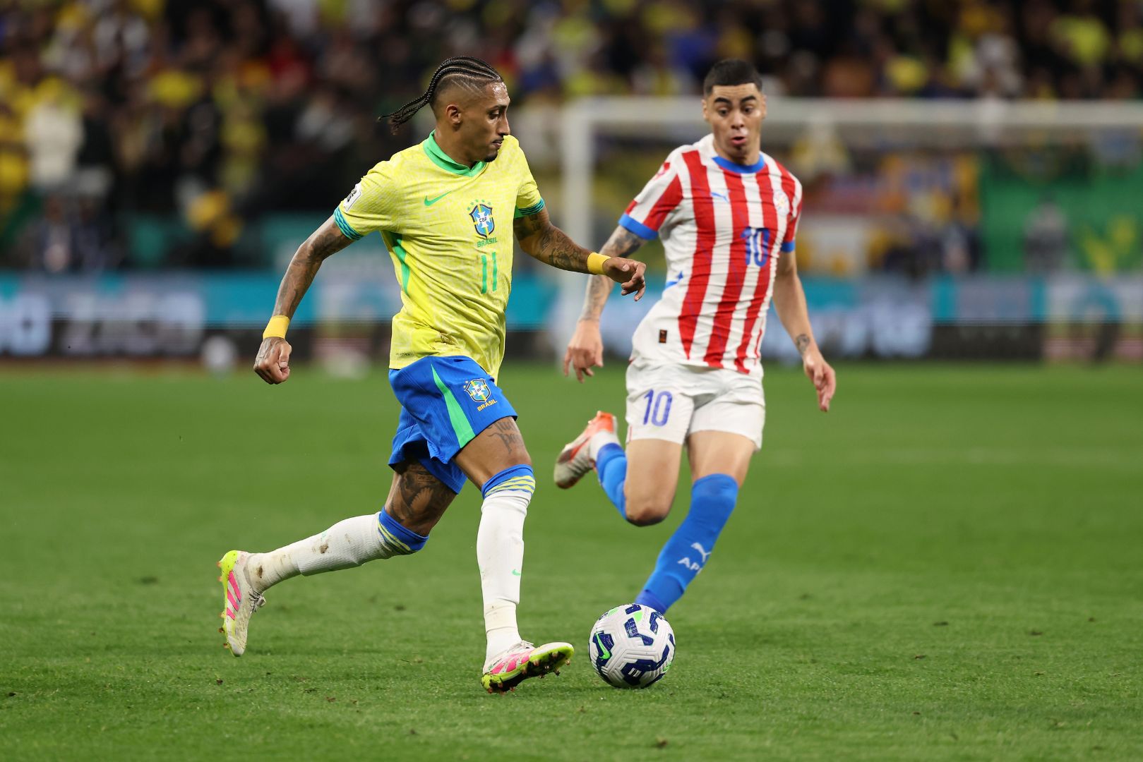 SAO PAULO, BRAZIL - JUNE 10: Raphinha of Brazil runs with the ball during the FIFA World Cup 2026 South American Qualifier between Brazil and Paraguay at Neo Quimica Arena on June 10, 2025 in Sao Paulo, Brazil.